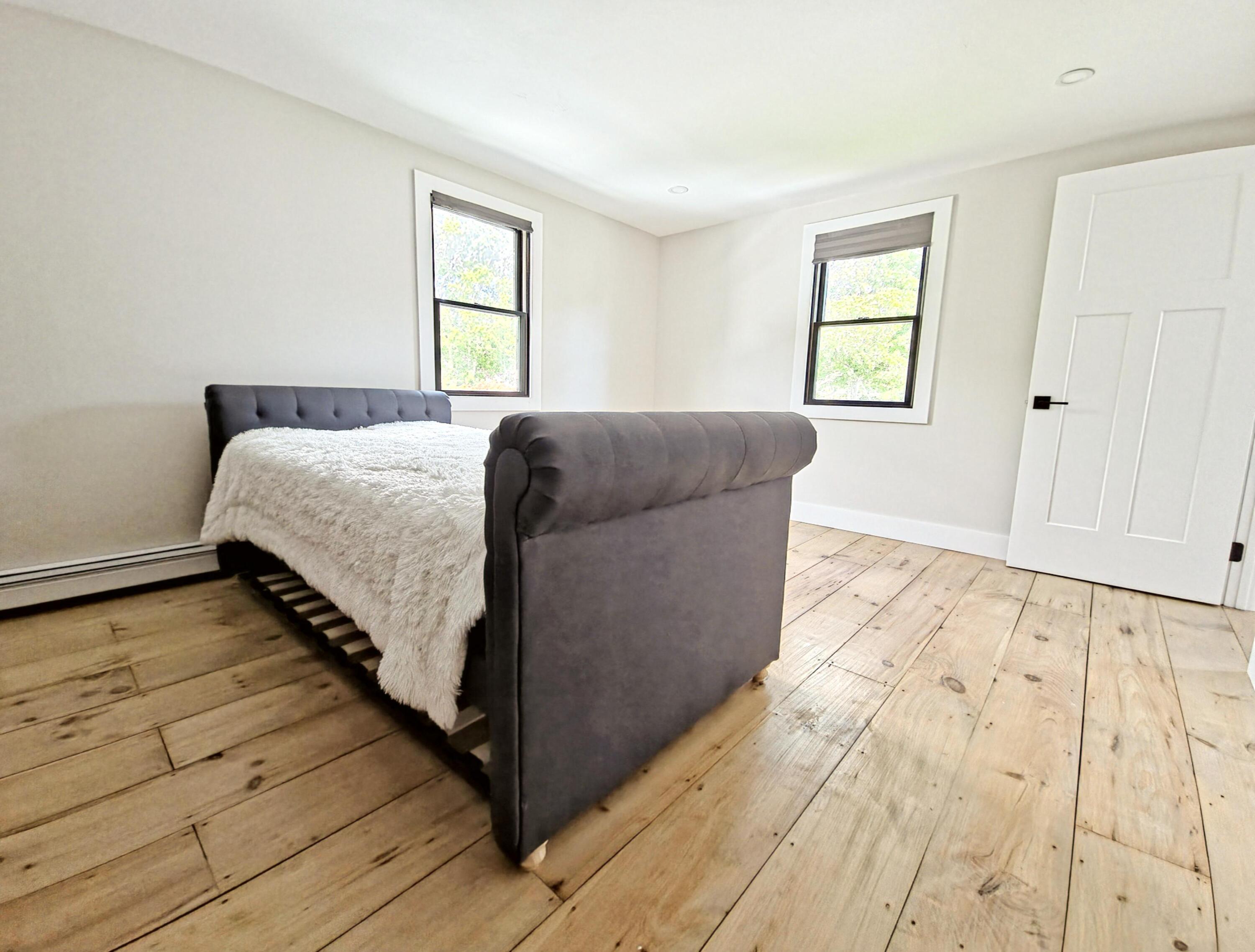 22 Keel Way Hyannis, MA 02601 - Photo 28 of 42 a bed sitting in a bedroom next to a window