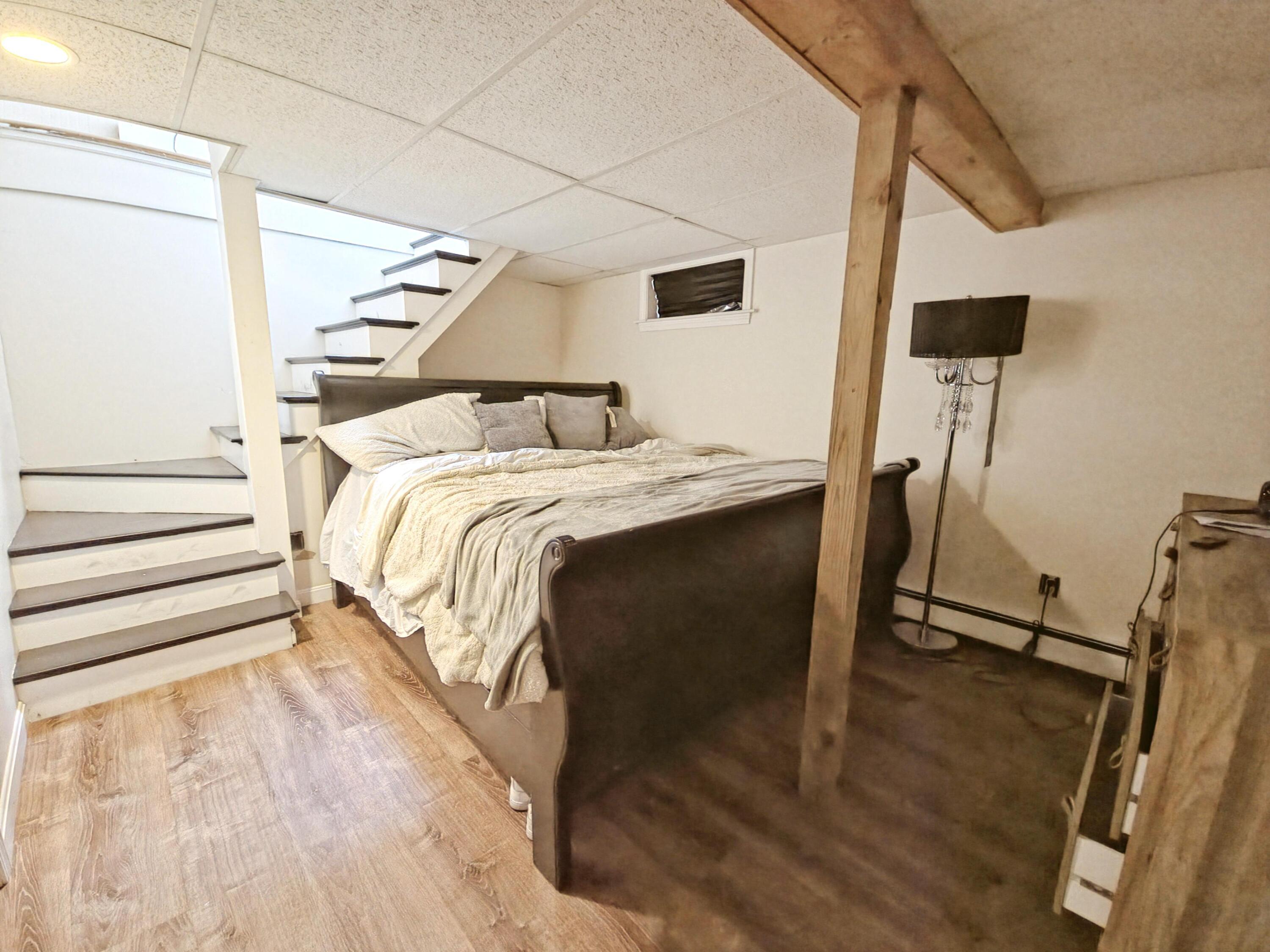 22 Keel Way Hyannis, MA 02601 - Photo 38 of 42 a bed sitting in a bedroom next to a window