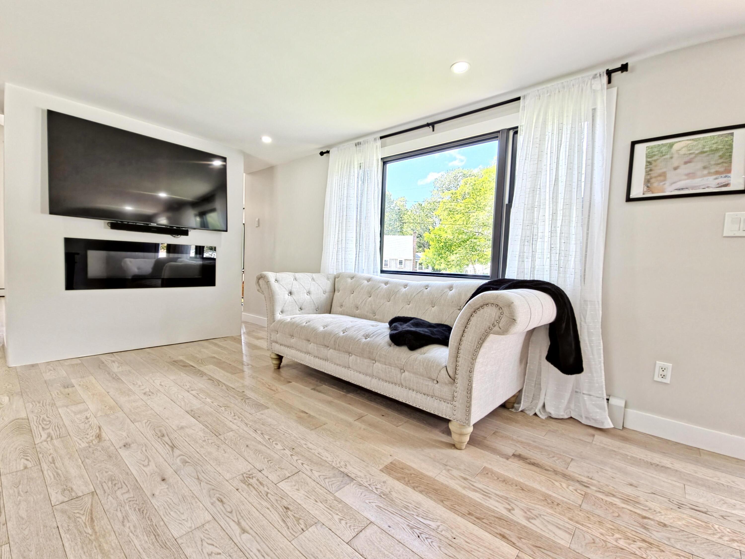 22 Keel Way Hyannis, MA 02601 - Photo 5 of 42 a living room with furniture and a flat screen tv