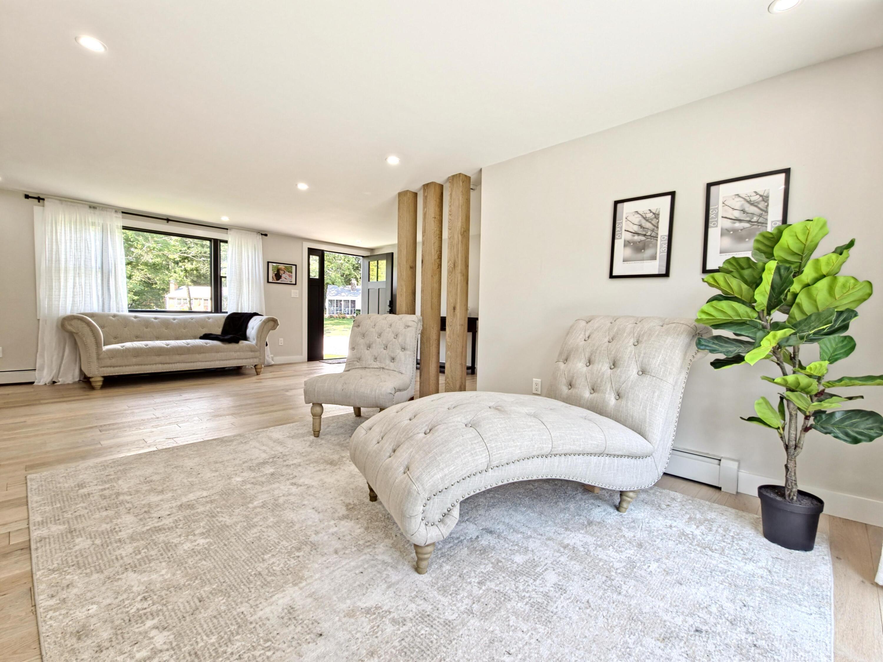 22 Keel Way Hyannis, MA 02601 - Photo 9 of 42 a living room with furniture and a potted plant