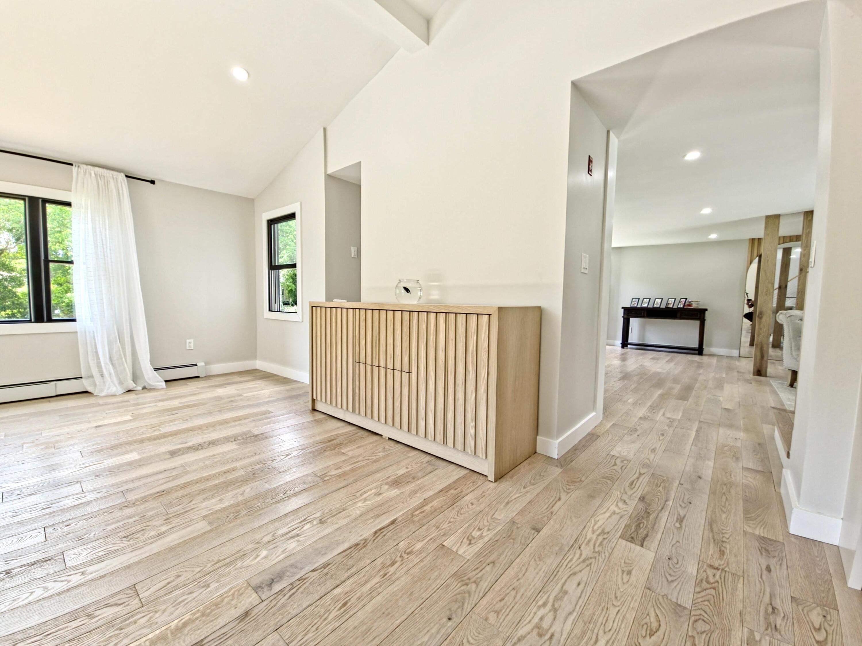 22 Keel Way Hyannis, MA 02601 - Photo 10 of 42 an empty room with wooden floor and windows