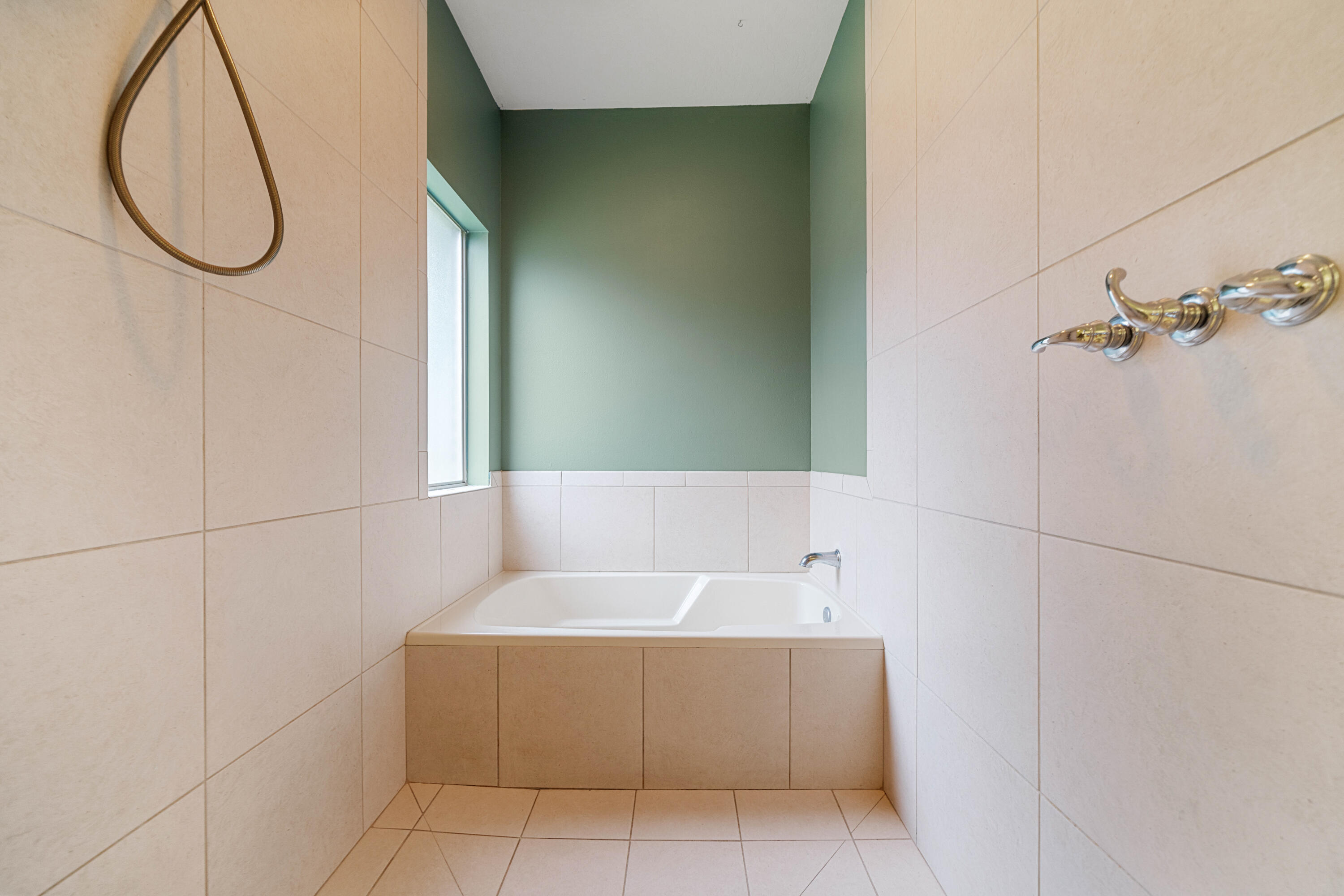 4588 Hermosa Road Crestview, FL 32539 - Photo 23 of 38 a bathroom with a bathtub and shower