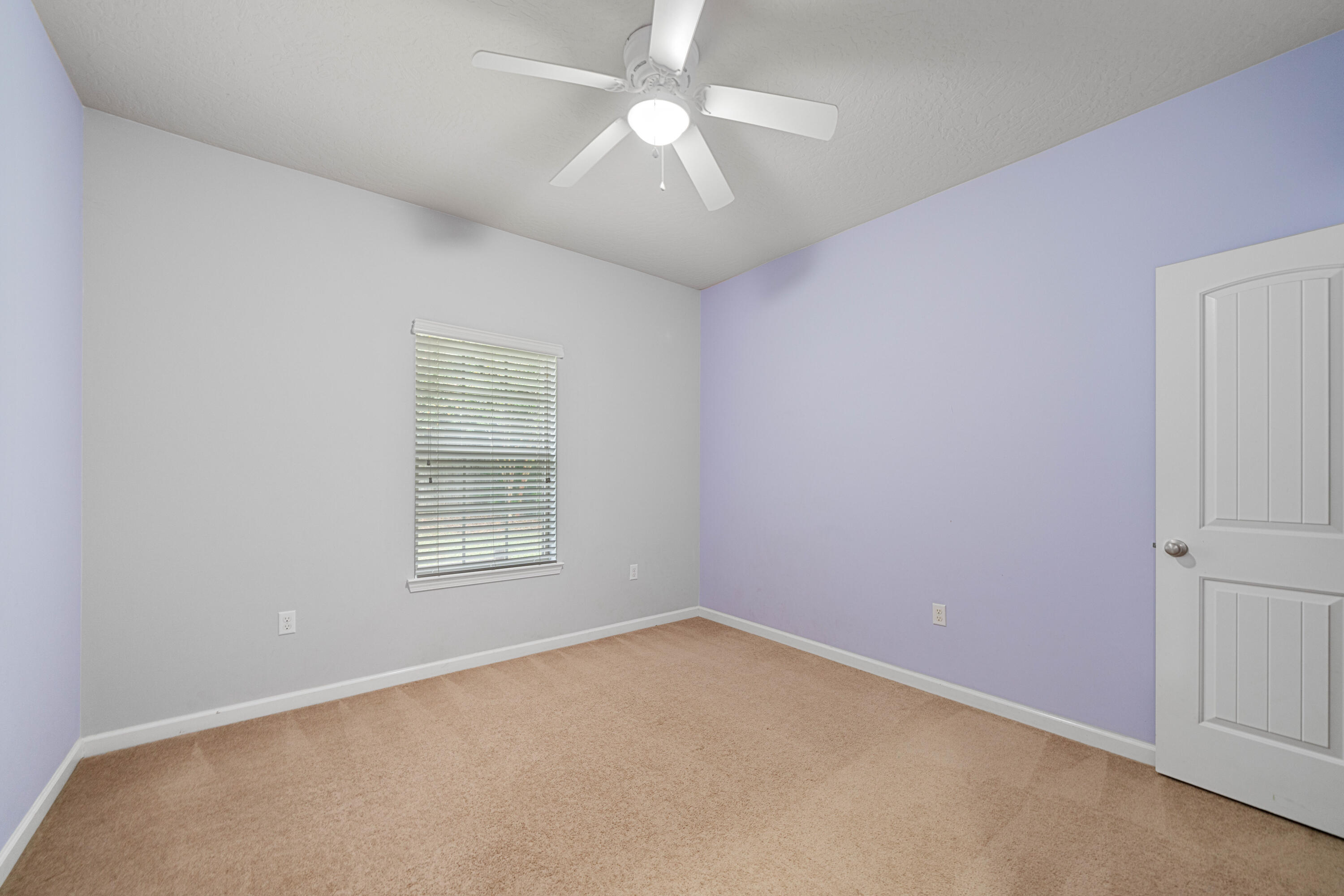 4588 Hermosa Road Crestview, FL 32539 - Photo 27 of 38 an empty room with a window and a fan