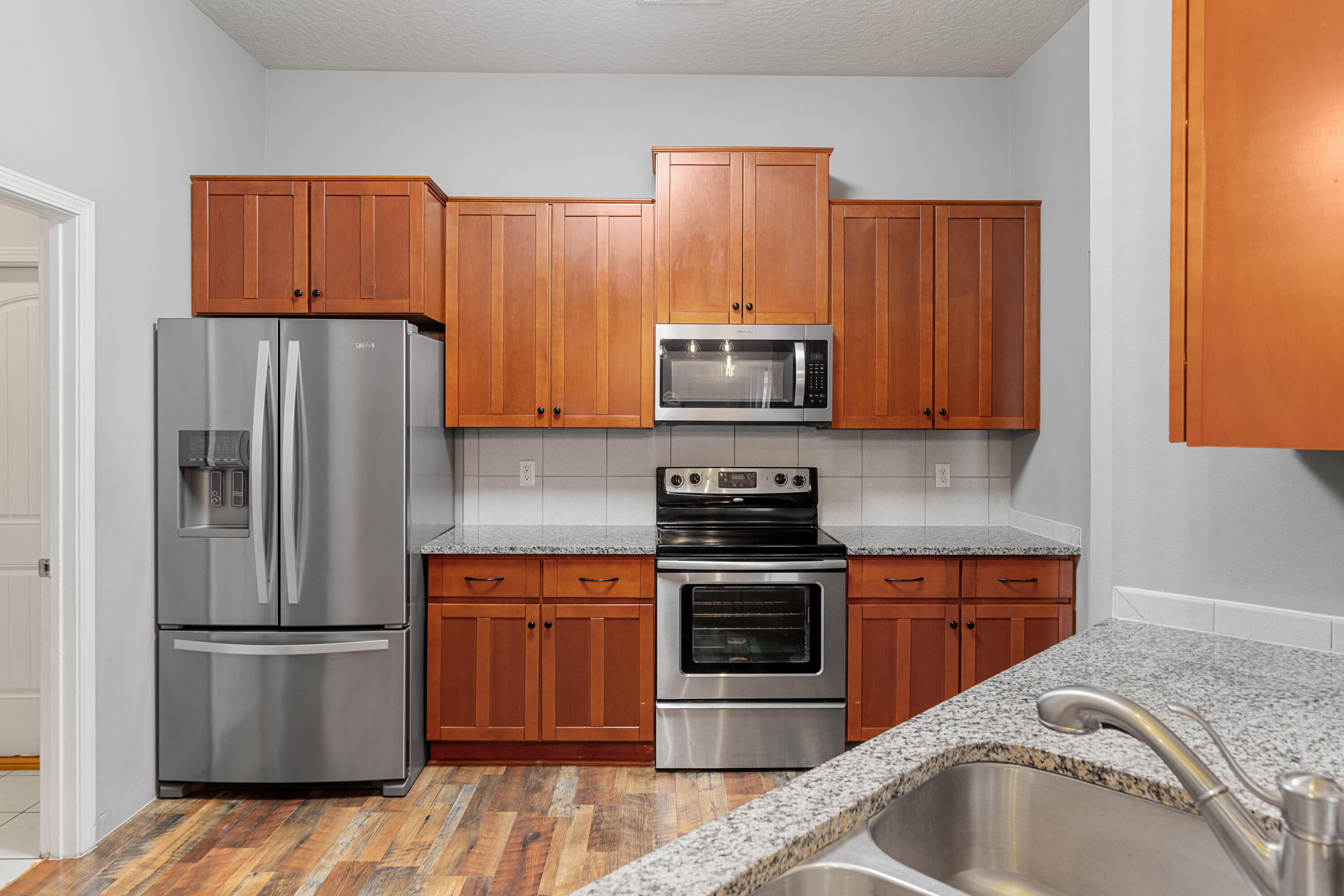 4588 Hermosa Road Crestview, FL 32539 - Photo 5 of 38 a kitchen with a refrigerator sink and microwave
