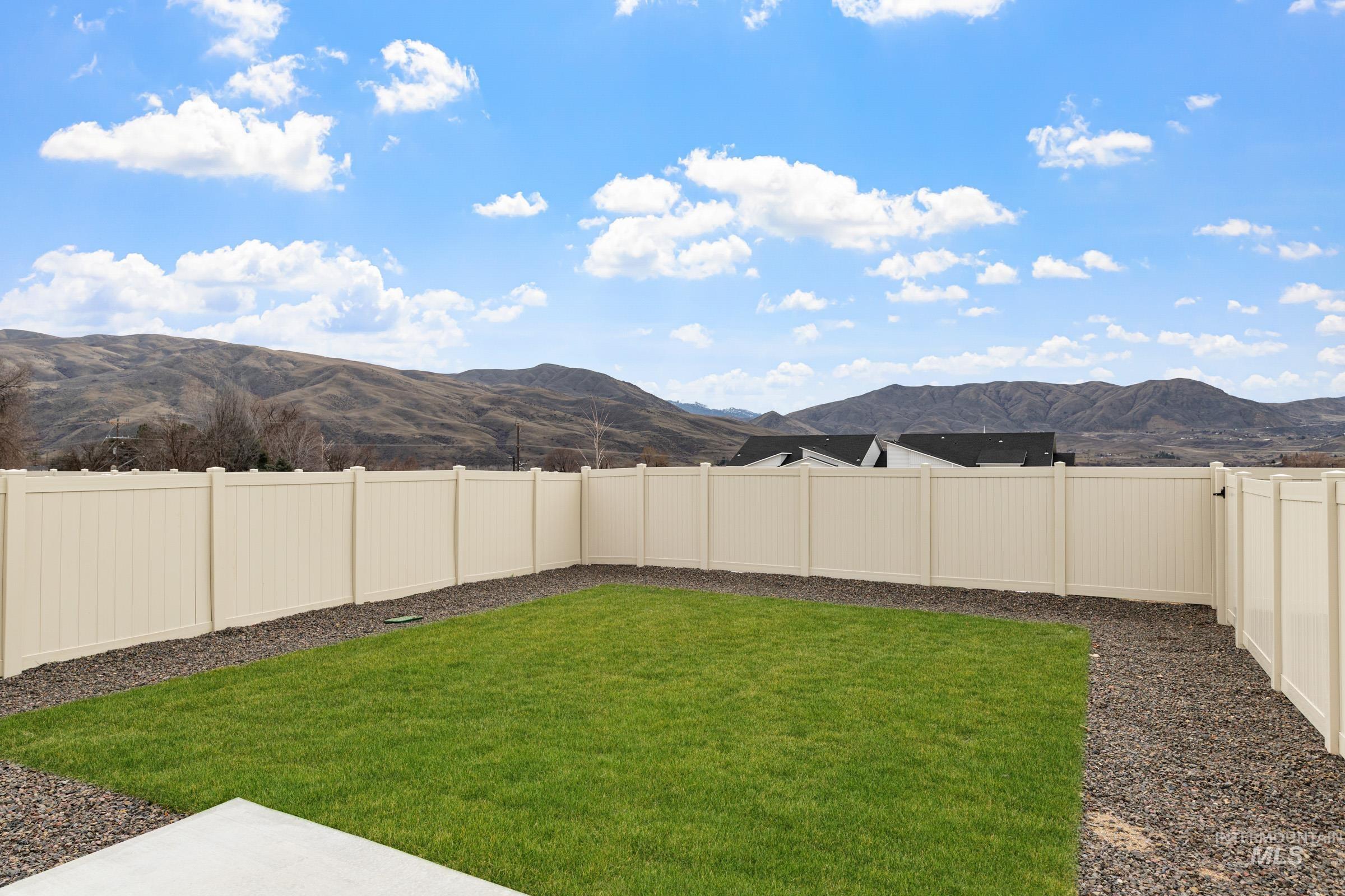 223 Moose Street Horseshoe Bend, ID 83629 - Photo 22 of 24 Fenced backyard with a mountain view