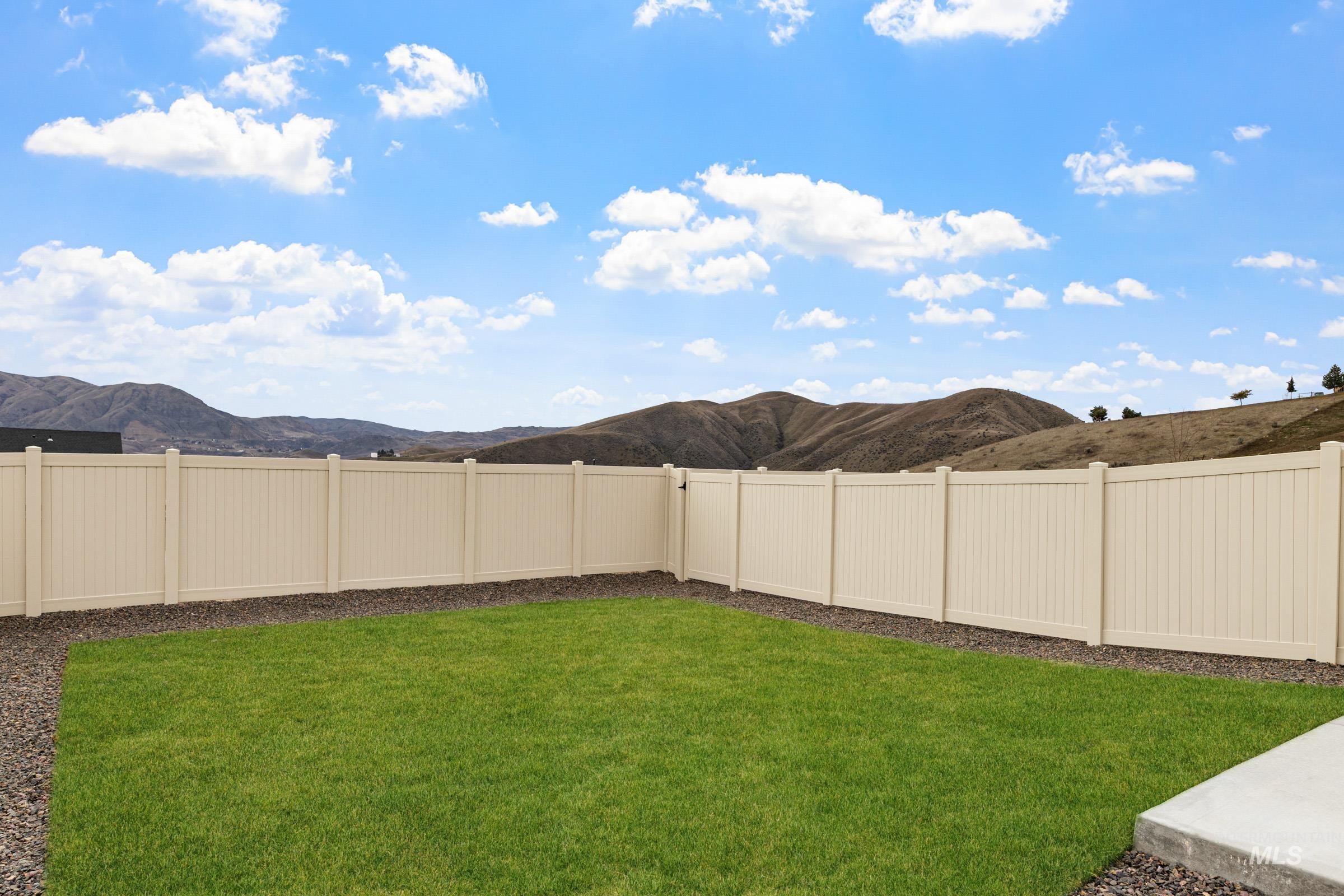 223 Moose Street Horseshoe Bend, ID 83629 - Photo 23 of 24 Fenced backyard featuring a mountain view