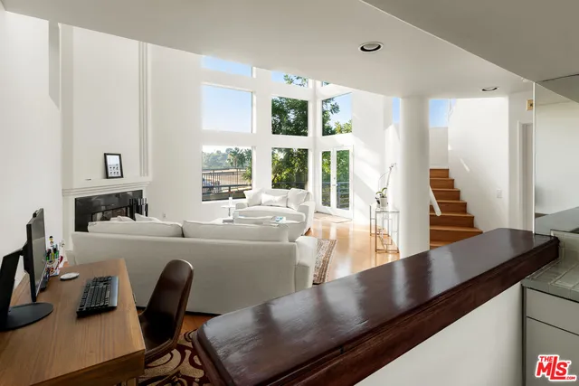 a view of kitchen island with furniture and wooden floor