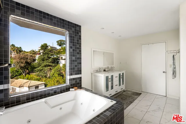 a kitchen with a sink stove and refrigerator