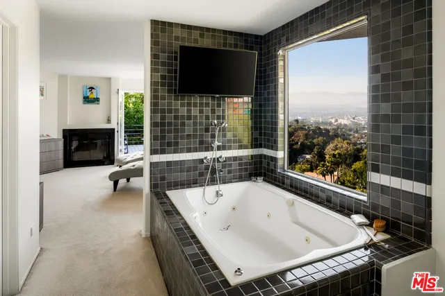 a bathroom with a bathtub and a sink