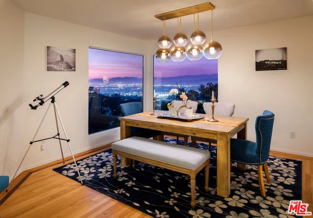 a living room with furniture a rug and a fireplace