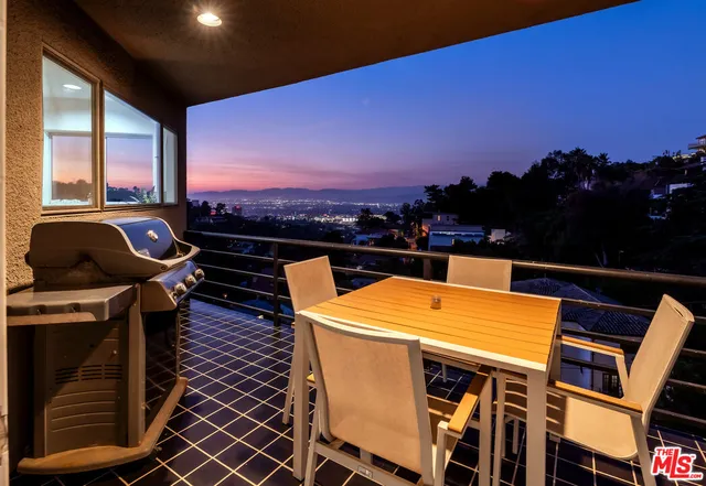 a view of a balcony with an outdoor space