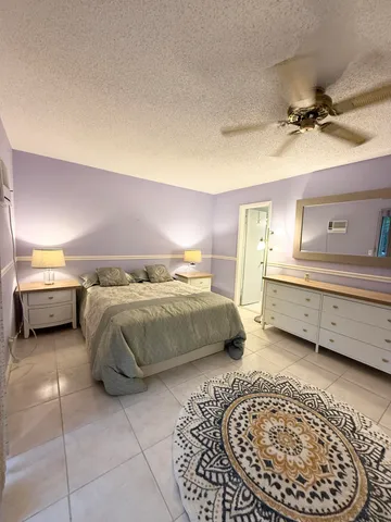 a bathroom with a sink vanity and toilet