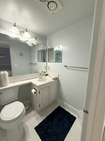 a view of a livingroom with furniture and a dining room