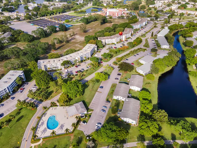 a view of a swimming pool with a outdoor seating
