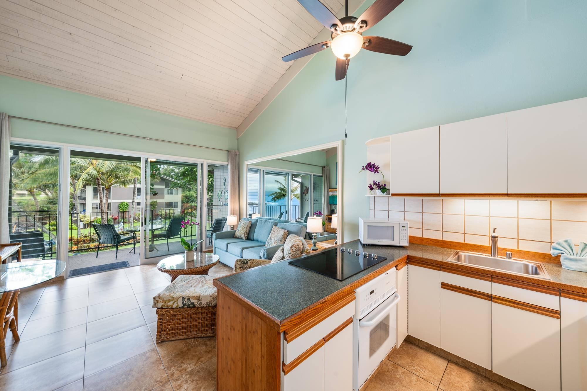 5255 Lower Honoapiilani Road, Unit 207 Lahaina, HI 96761 - Photo 13 of 49 a kitchen that has a lot of cabinets in it