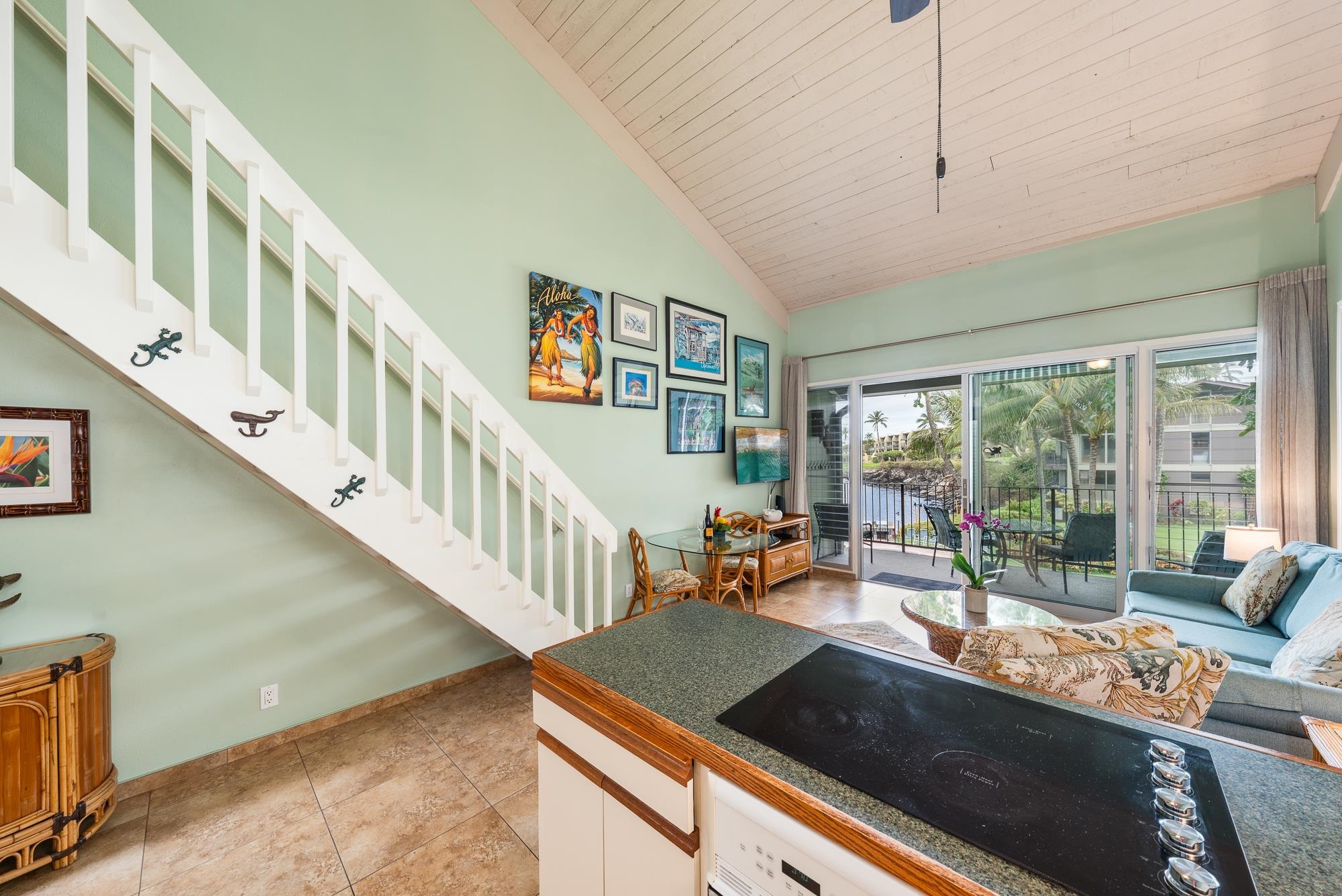 5255 Lower Honoapiilani Road, Unit 207 Lahaina, HI 96761 - Photo 15 of 49 a view of a livingroom with furniture a ceiling fan and front door