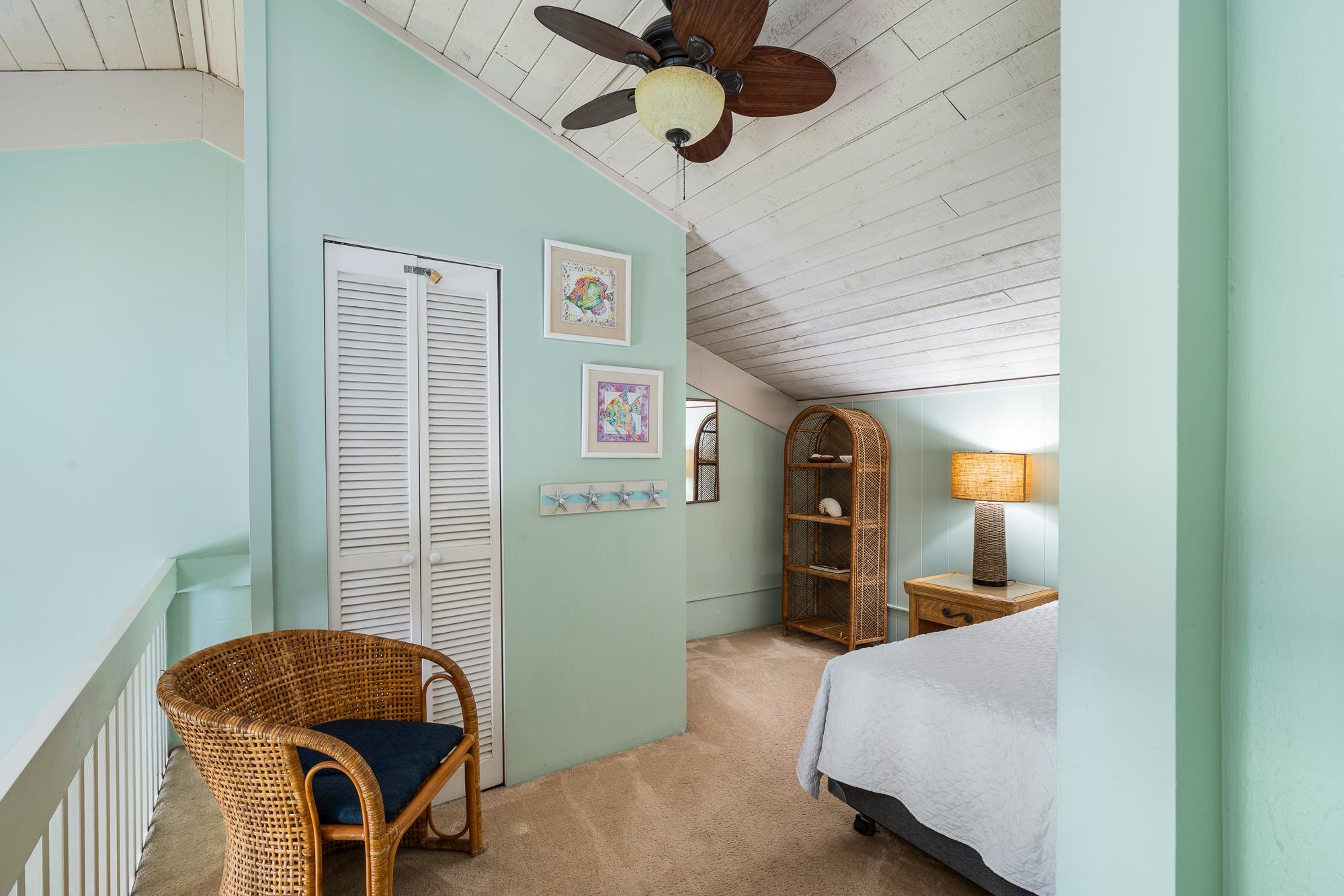 5255 Lower Honoapiilani Road, Unit 207 Lahaina, HI 96761 - Photo 26 of 49 a bedroom with a bed and a mirror