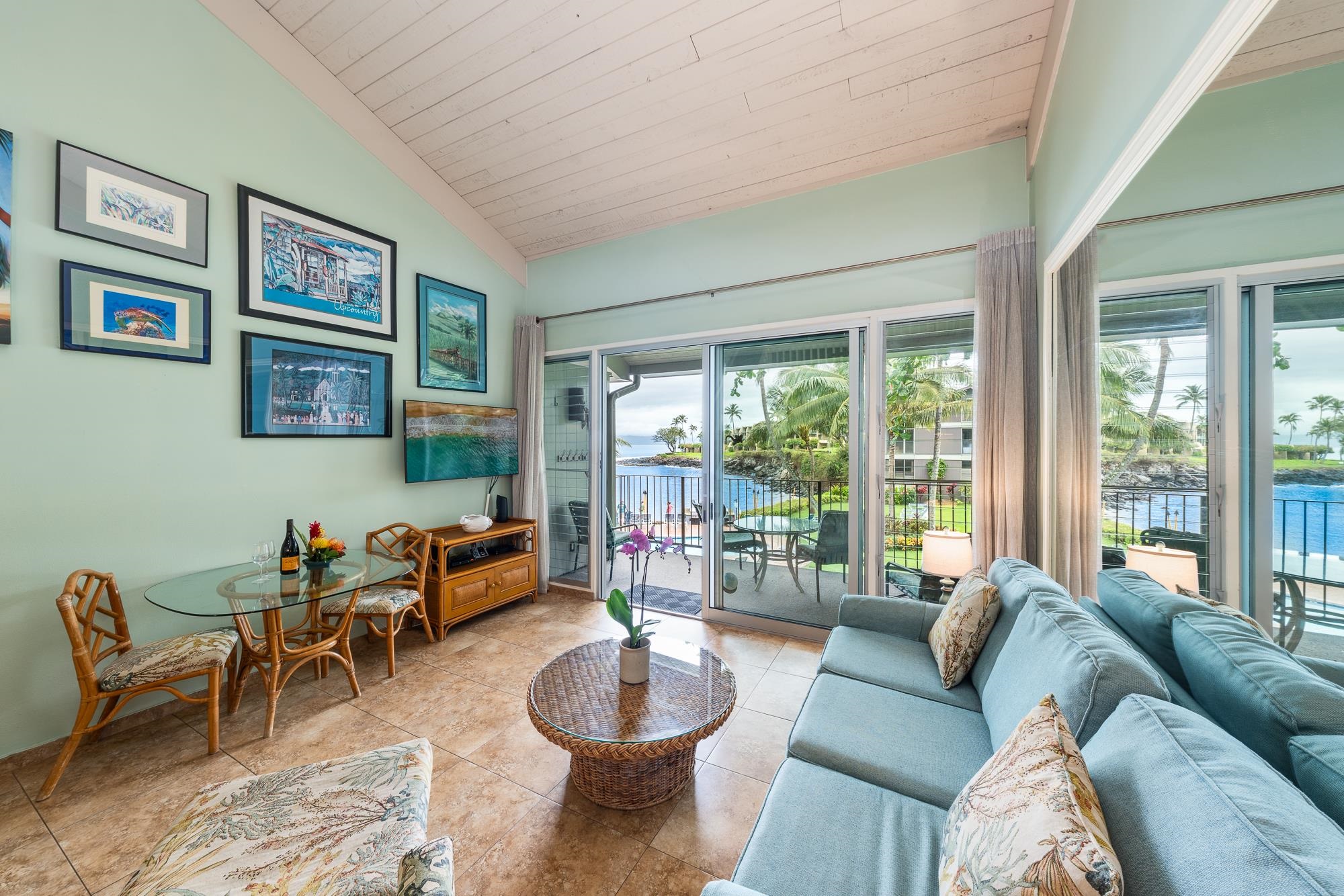 5255 Lower Honoapiilani Road, Unit 207 Lahaina, HI 96761 - Photo 32 of 49 a living room with furniture and a large window