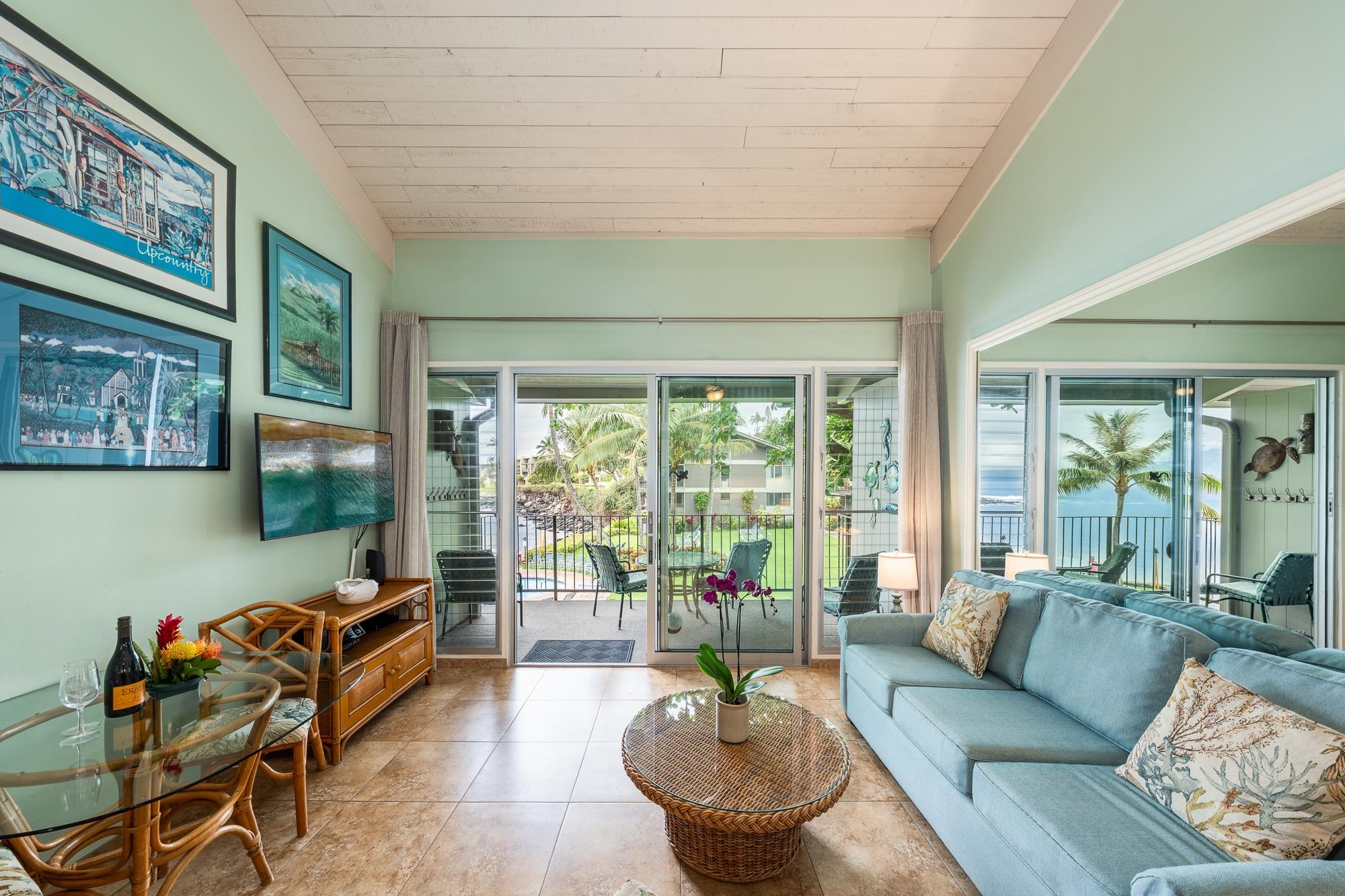 5255 Lower Honoapiilani Road, Unit 207 Lahaina, HI 96761 - Photo 4 of 49 a living room with furniture and a large window