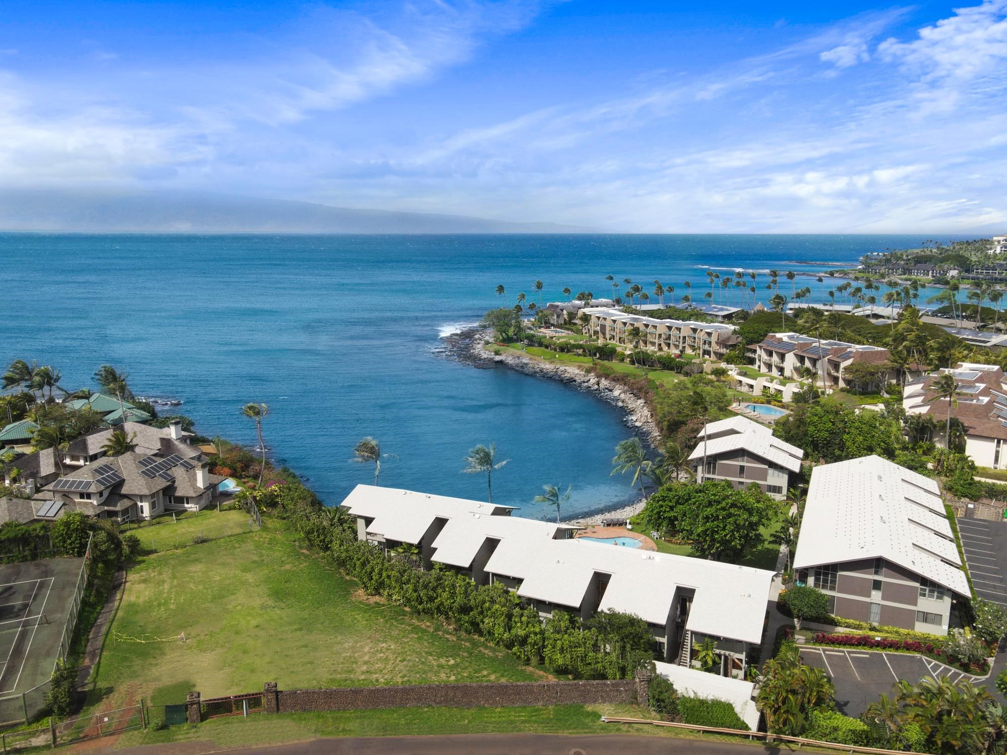 5255 Lower Honoapiilani Road, Unit 207 Lahaina, HI 96761 - Photo 44 of 49 an aerial view of a house with a yard
