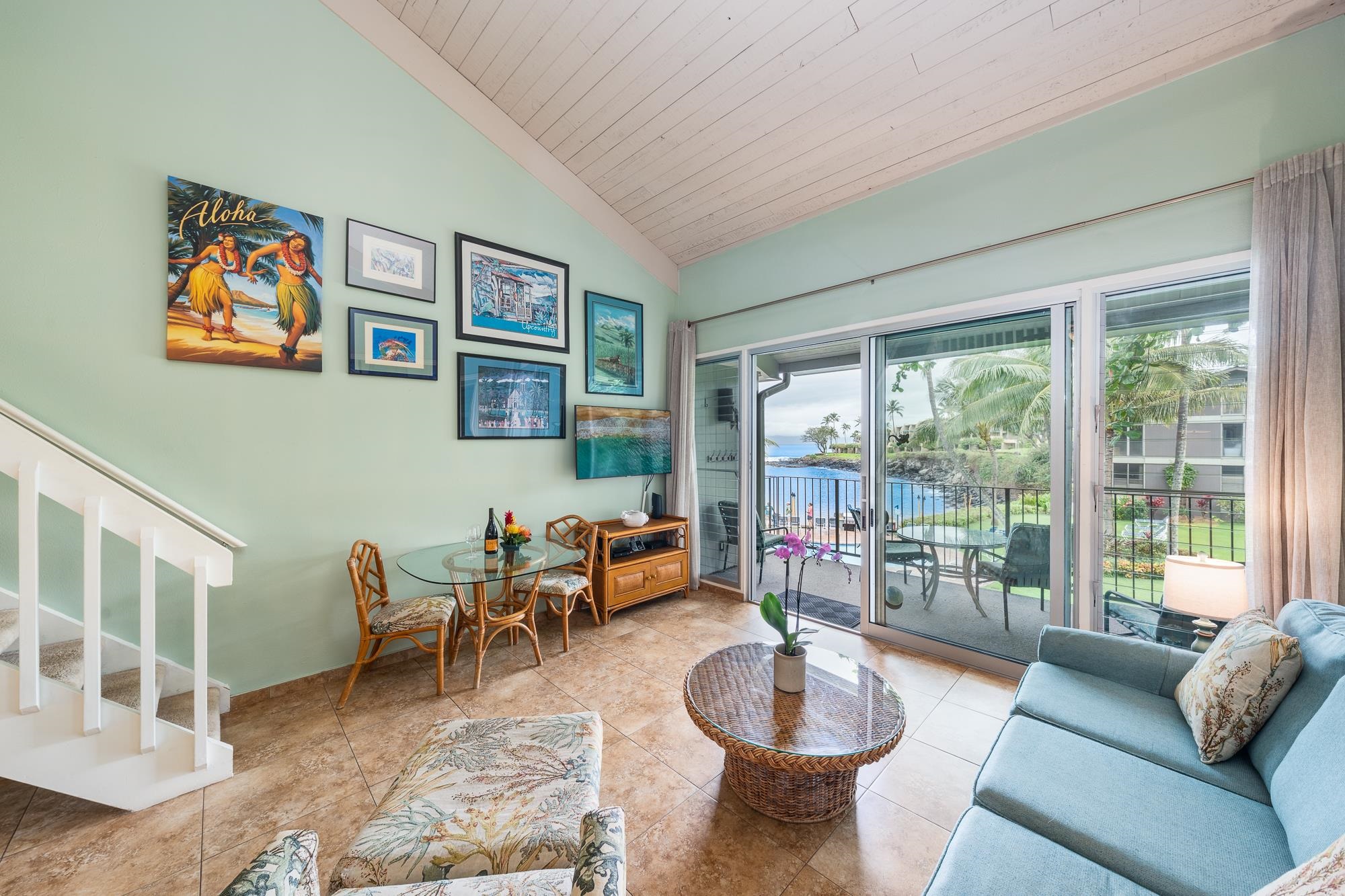 5255 Lower Honoapiilani Road, Unit 207 Lahaina, HI 96761 - Photo 5 of 49 a living room with furniture and a large window