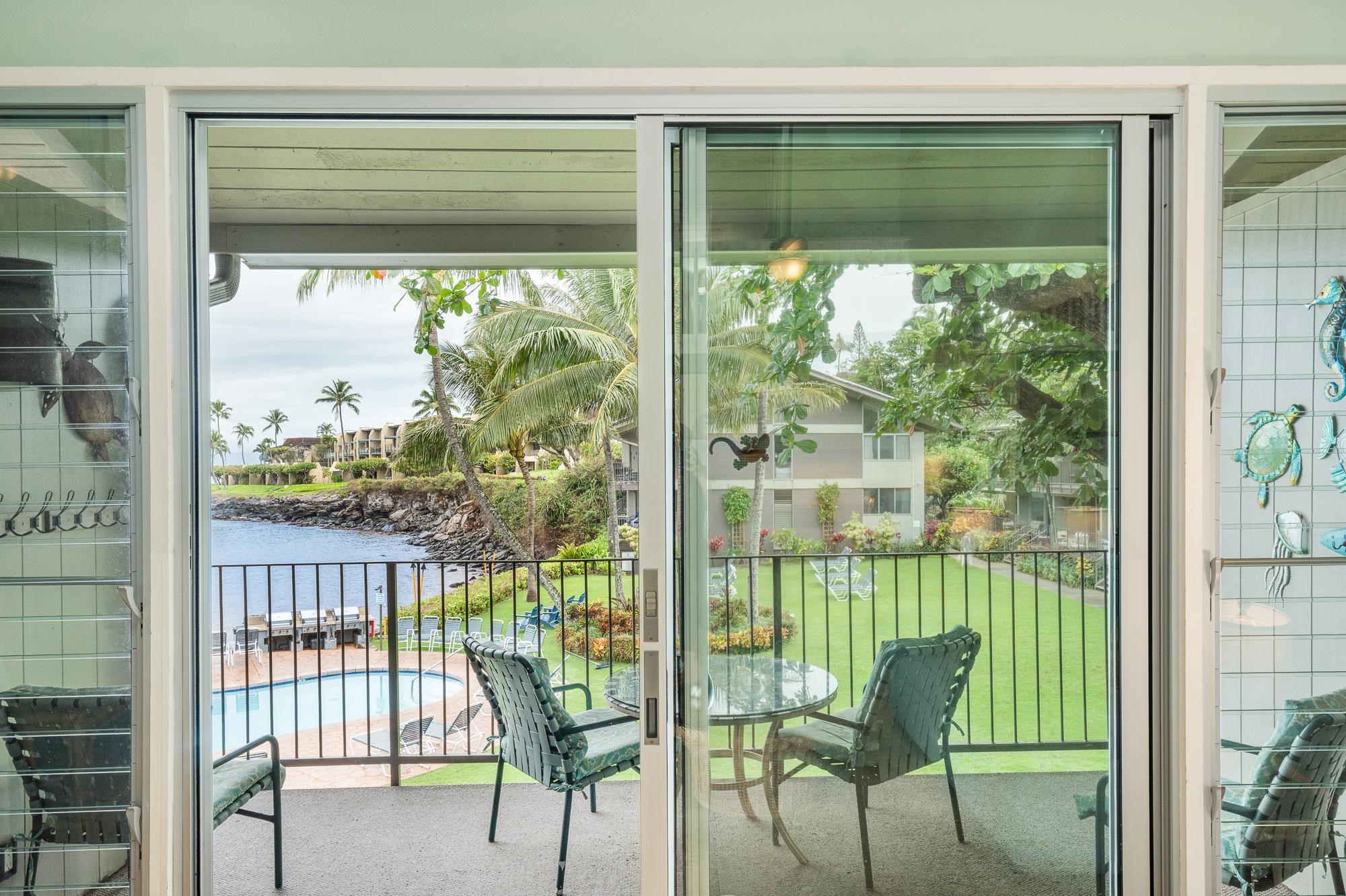 5255 Lower Honoapiilani Road, Unit 207 Lahaina, HI 96761 - Photo 7 of 49 a view of a room with two chairs and a porch