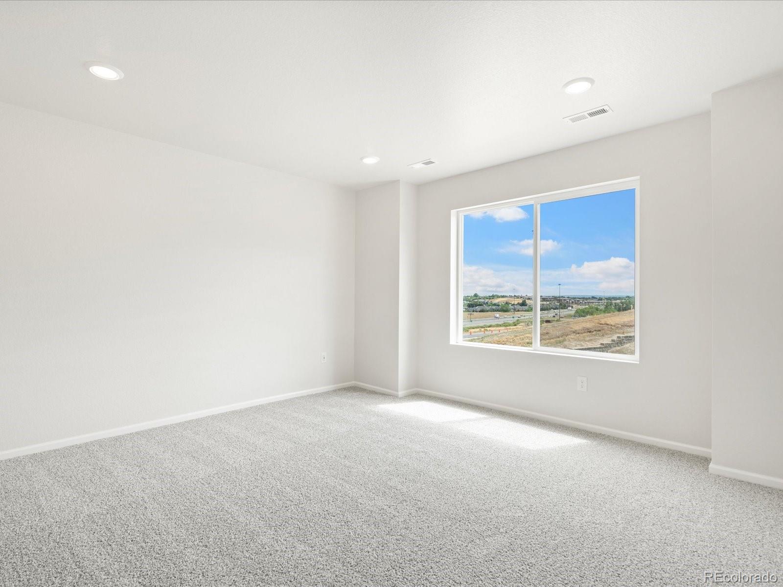 14472 Pansy Loop Morrison, CO 80465 - Photo 26 of 37 a view of an empty room with a window