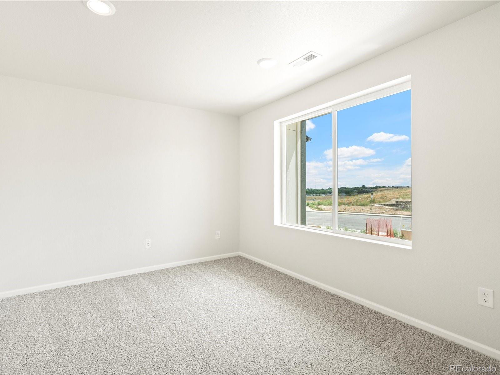 14472 Pansy Loop Morrison, CO 80465 - Photo 3 of 37 an empty room with a window