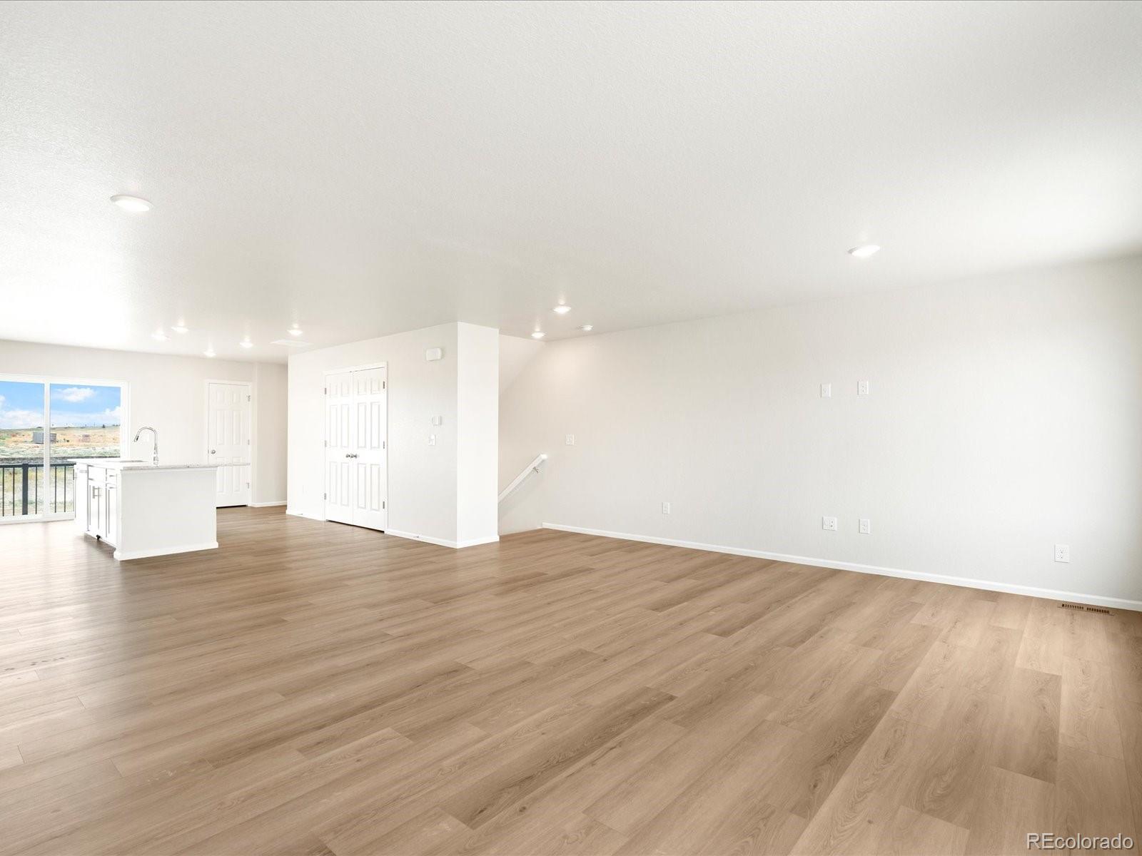 14472 Pansy Loop Morrison, CO 80465 - Photo 7 of 37 a view of empty room with wooden floor