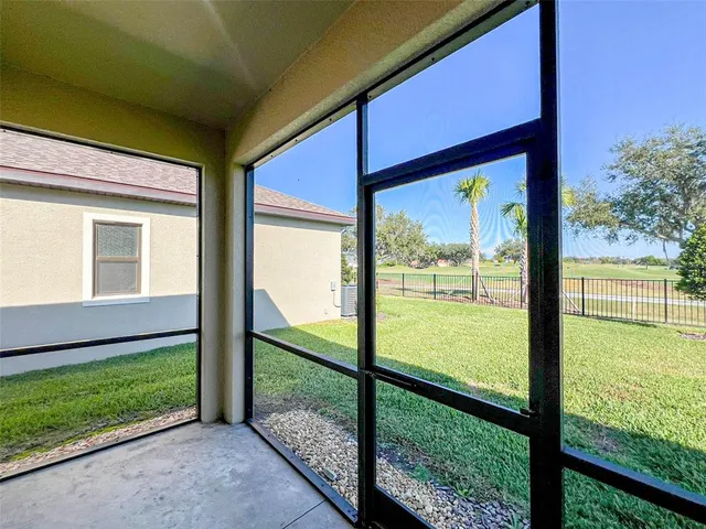 a view of a room that has a large window