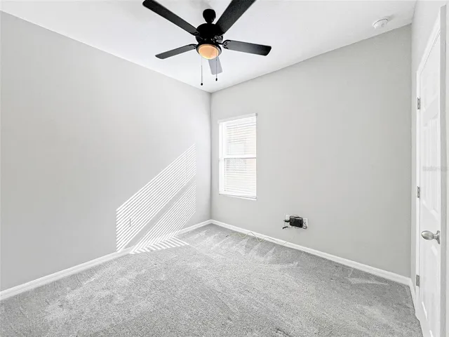 a view of room with ceiling fan