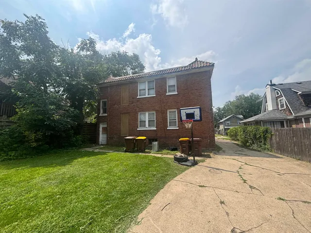 a house view with a sitting space and garden
