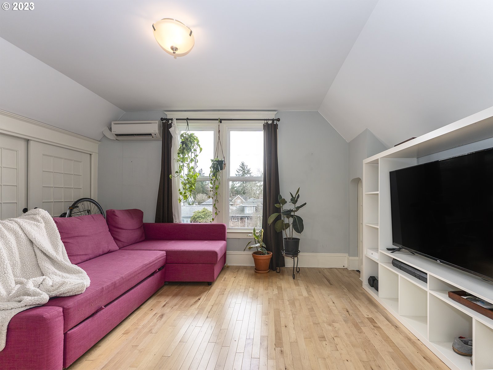 314 Northeast 69th Avenue Portland, OR 97213 - Photo 20 of 37 a living room with furniture and a flat screen tv