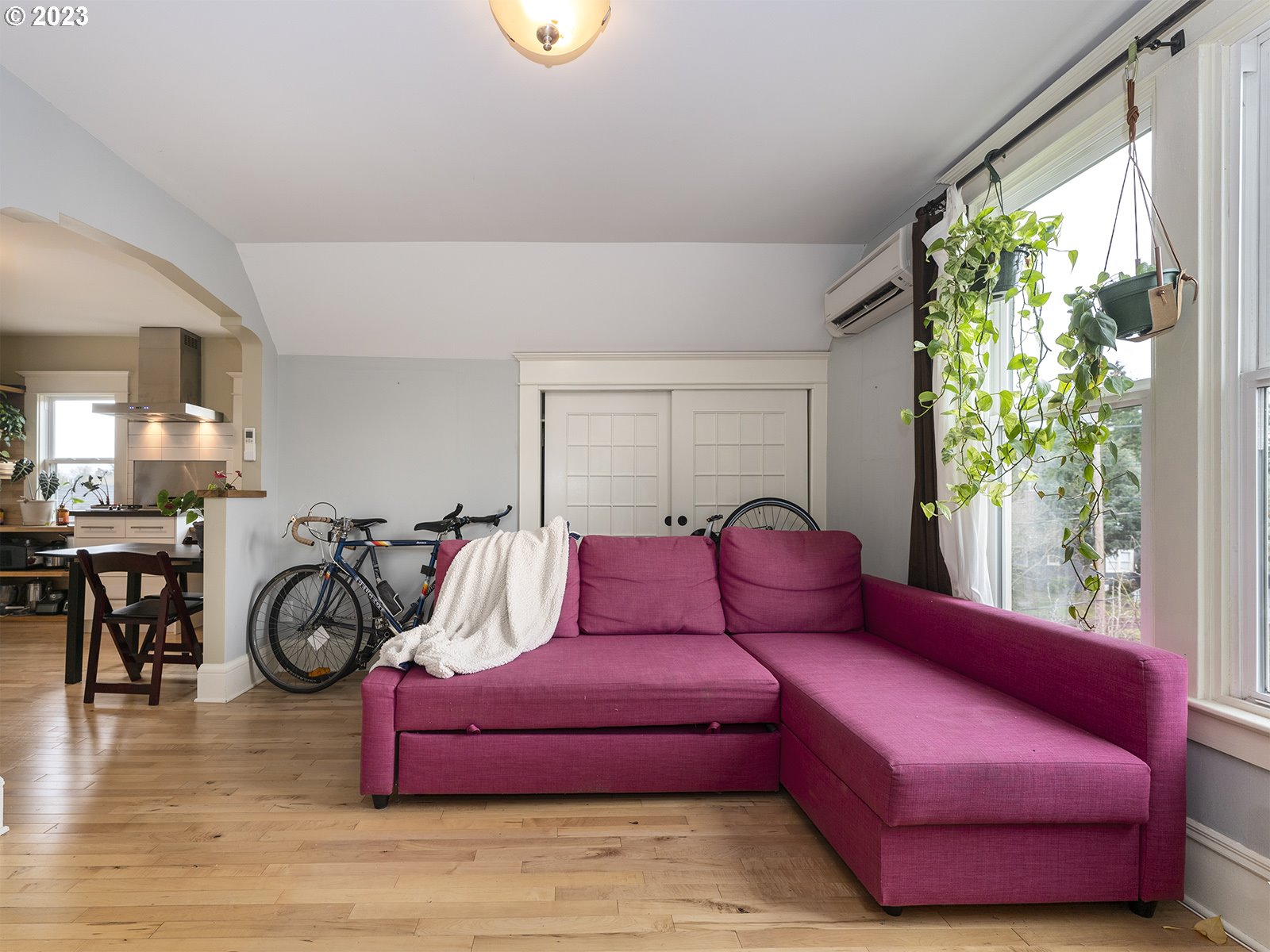 314 Northeast 69th Avenue Portland, OR 97213 - Photo 21 of 37 a living room with furniture a chandelier and a window