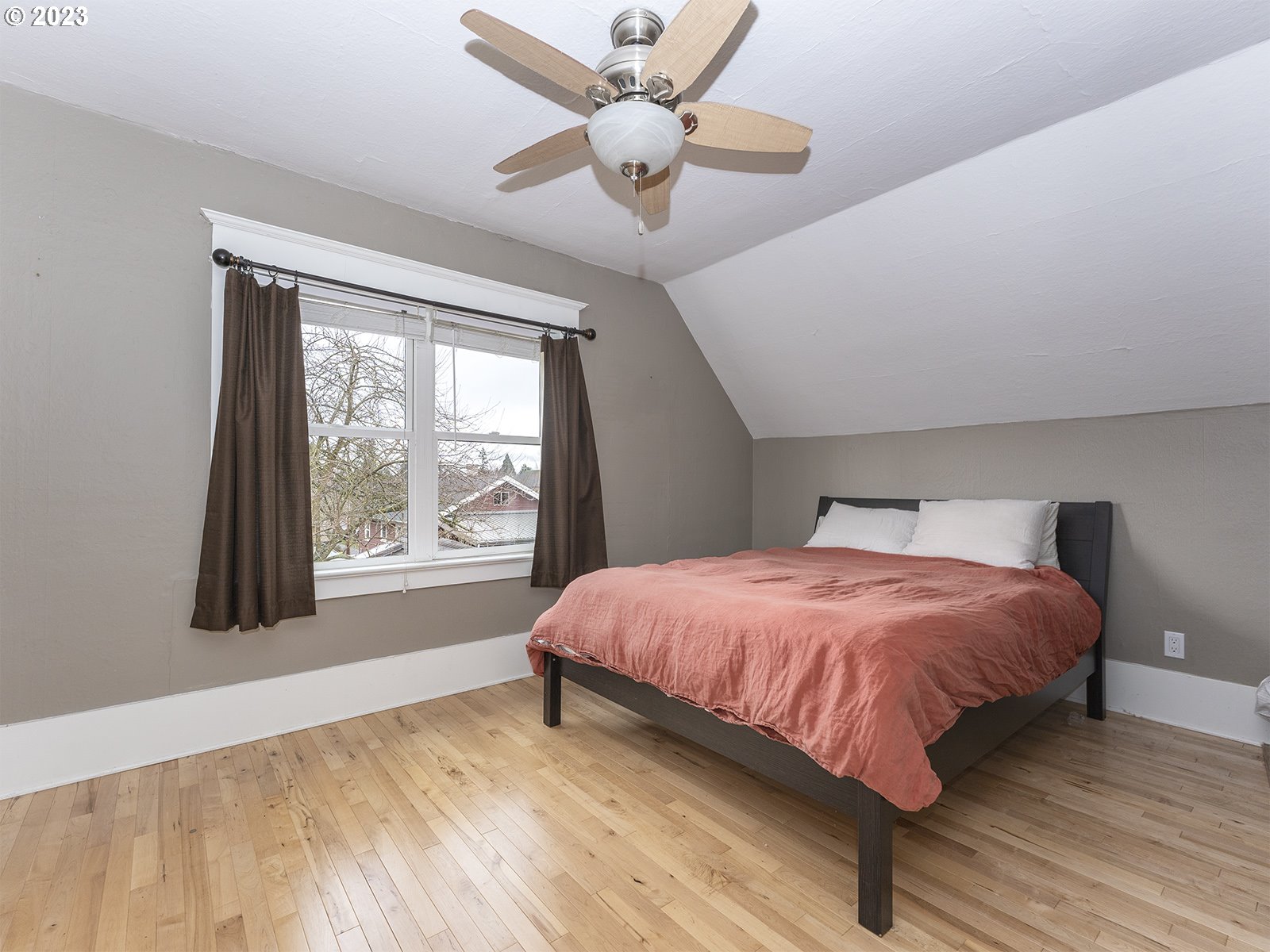 314 Northeast 69th Avenue Portland, OR 97213 - Photo 25 of 37 a bedroom with a bed and a large window
