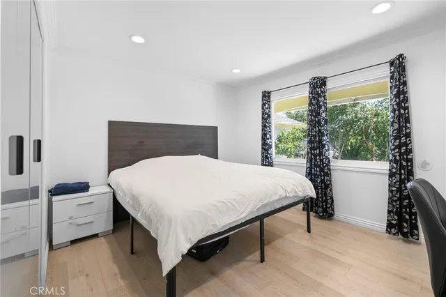 a bedroom with a bed and a table in it