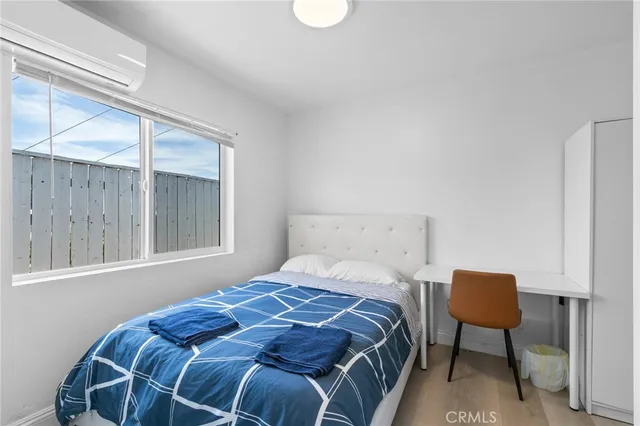 a room with a bed and a window