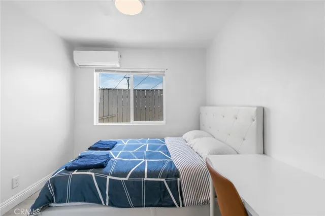 a bathroom with a sink toilet and a mirror
