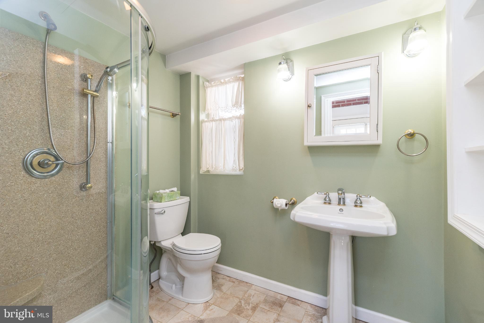 27 South 7th Street Quakertown, PA 18951 - Photo 13 of 33 a bathroom with a sink toilet and a mirror