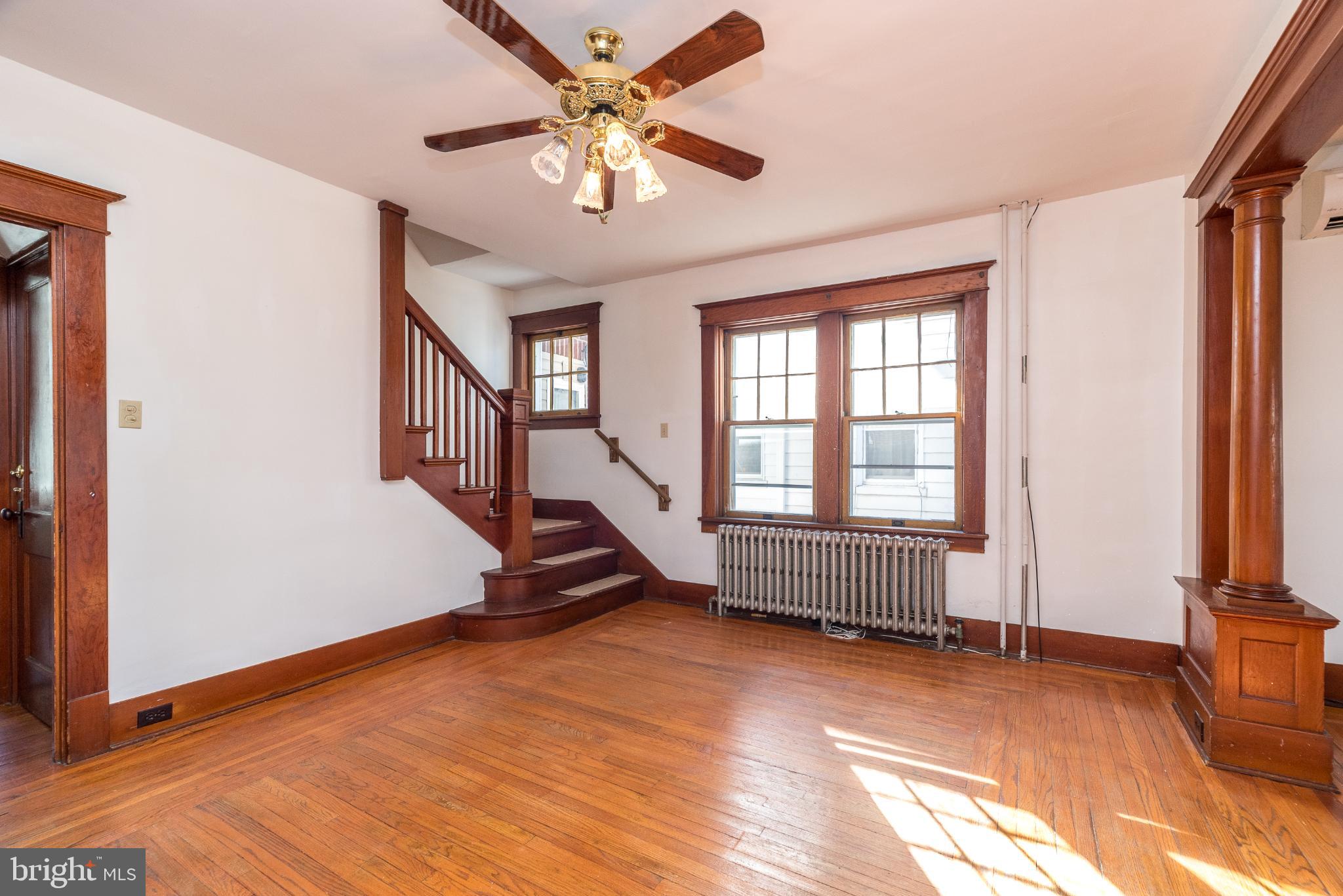 27 South 7th Street Quakertown, PA 18951 - Photo 14 of 33 an empty room with windows and ceiling fan