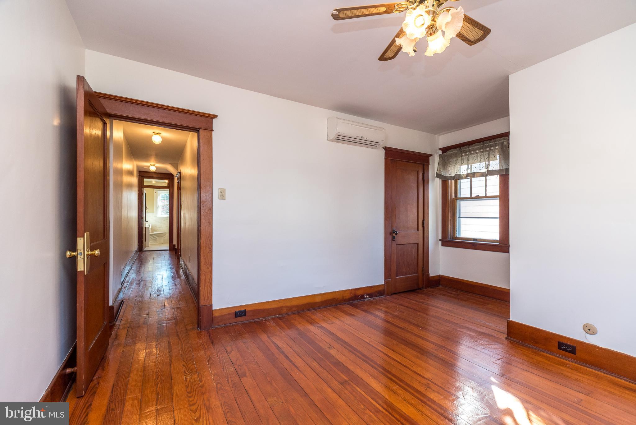 27 South 7th Street Quakertown, PA 18951 - Photo 15 of 33 wooden floor in an empty room with a window