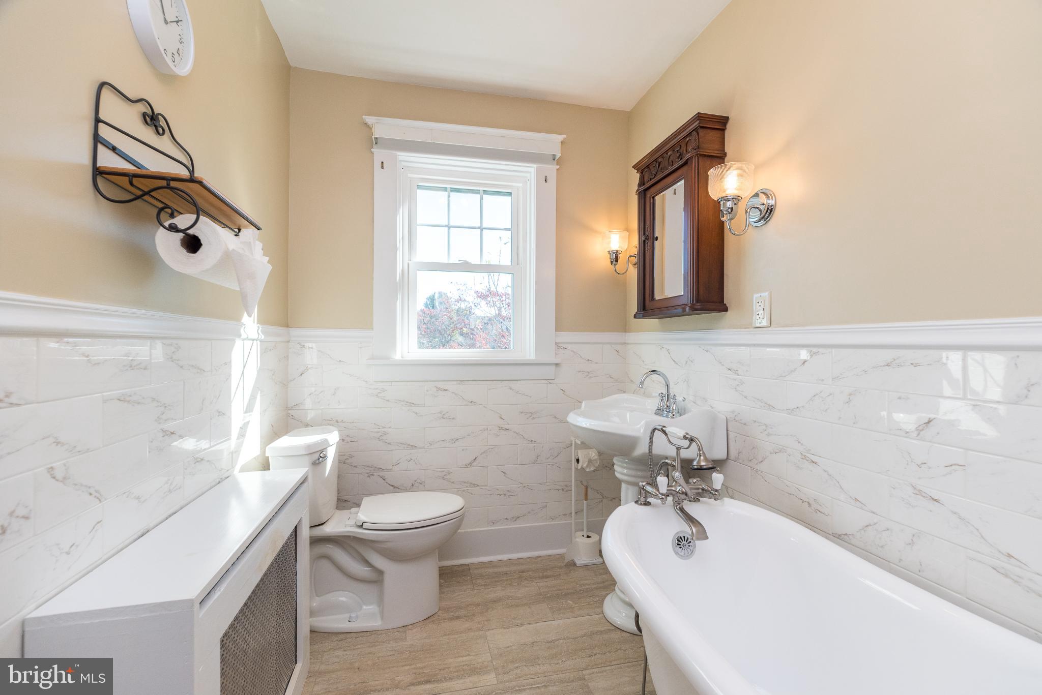 27 South 7th Street Quakertown, PA 18951 - Photo 17 of 33 a bathroom with a sink a toilet and a bathtub