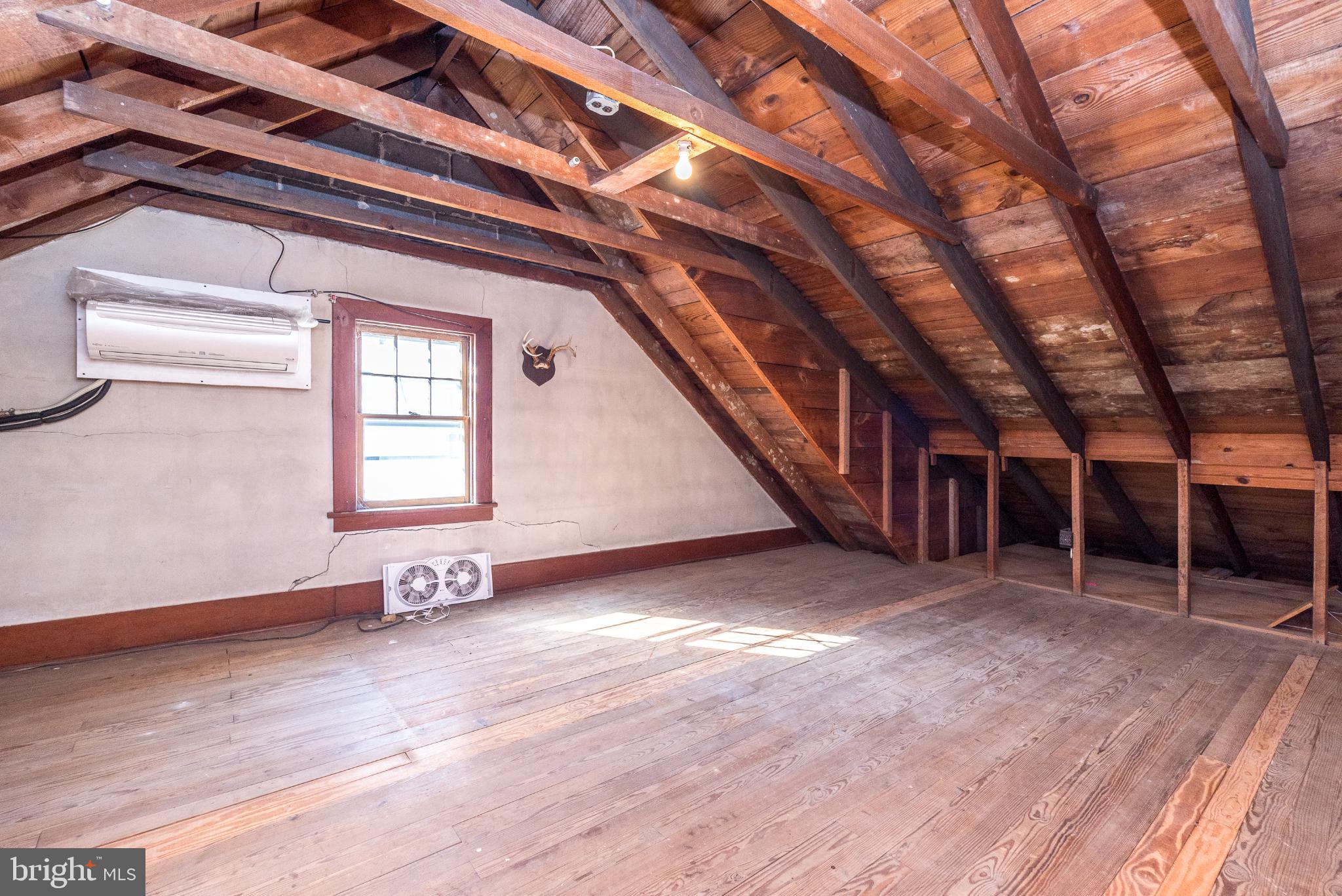 27 South 7th Street Quakertown, PA 18951 - Photo 21 of 33 a view of an empty room with wooden floor and stairs