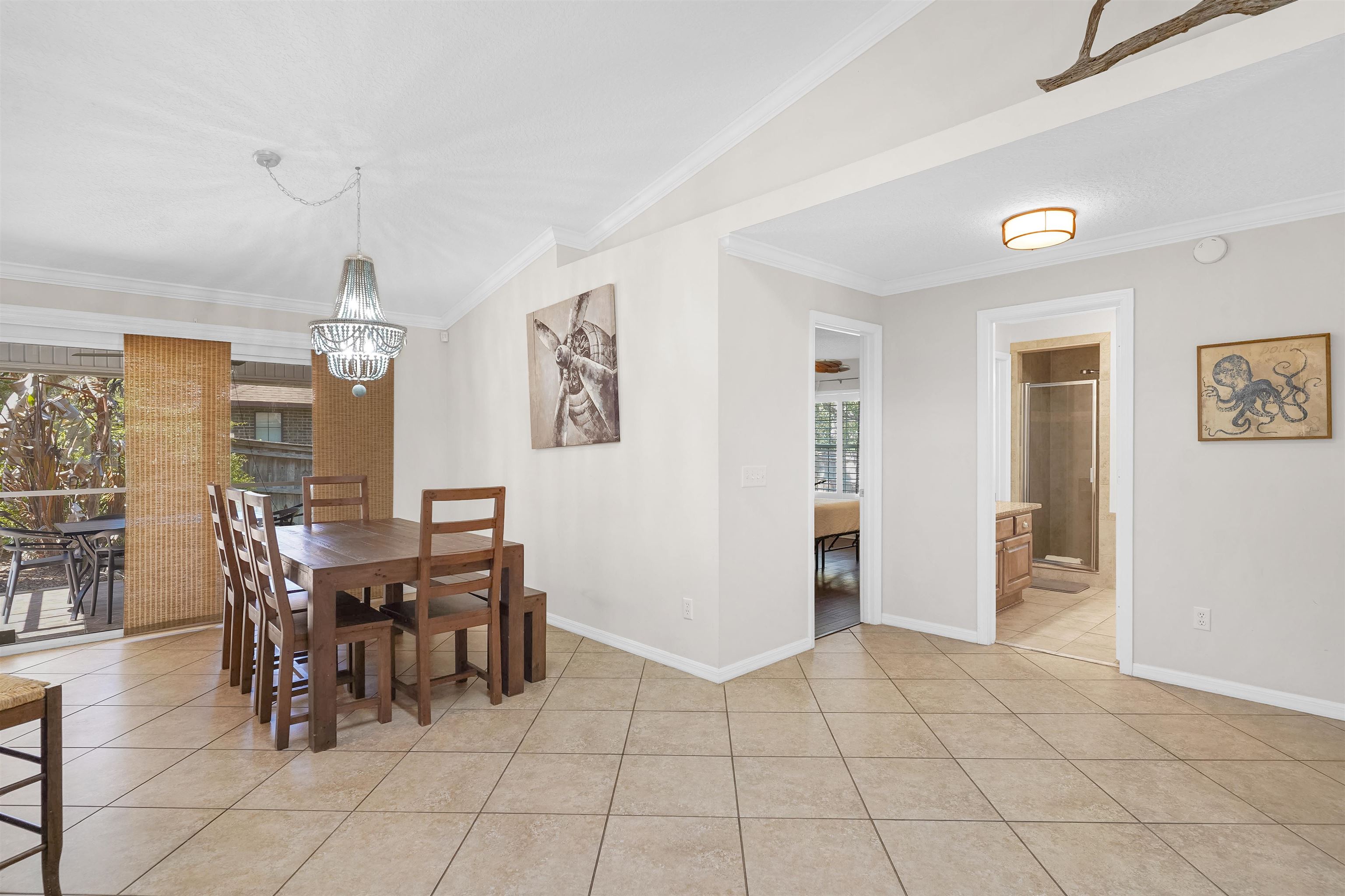 404 Fourteenth Street St. Augustine, FL 32084 - Photo 13 of 35 a view of a dining room with furniture and chandelier