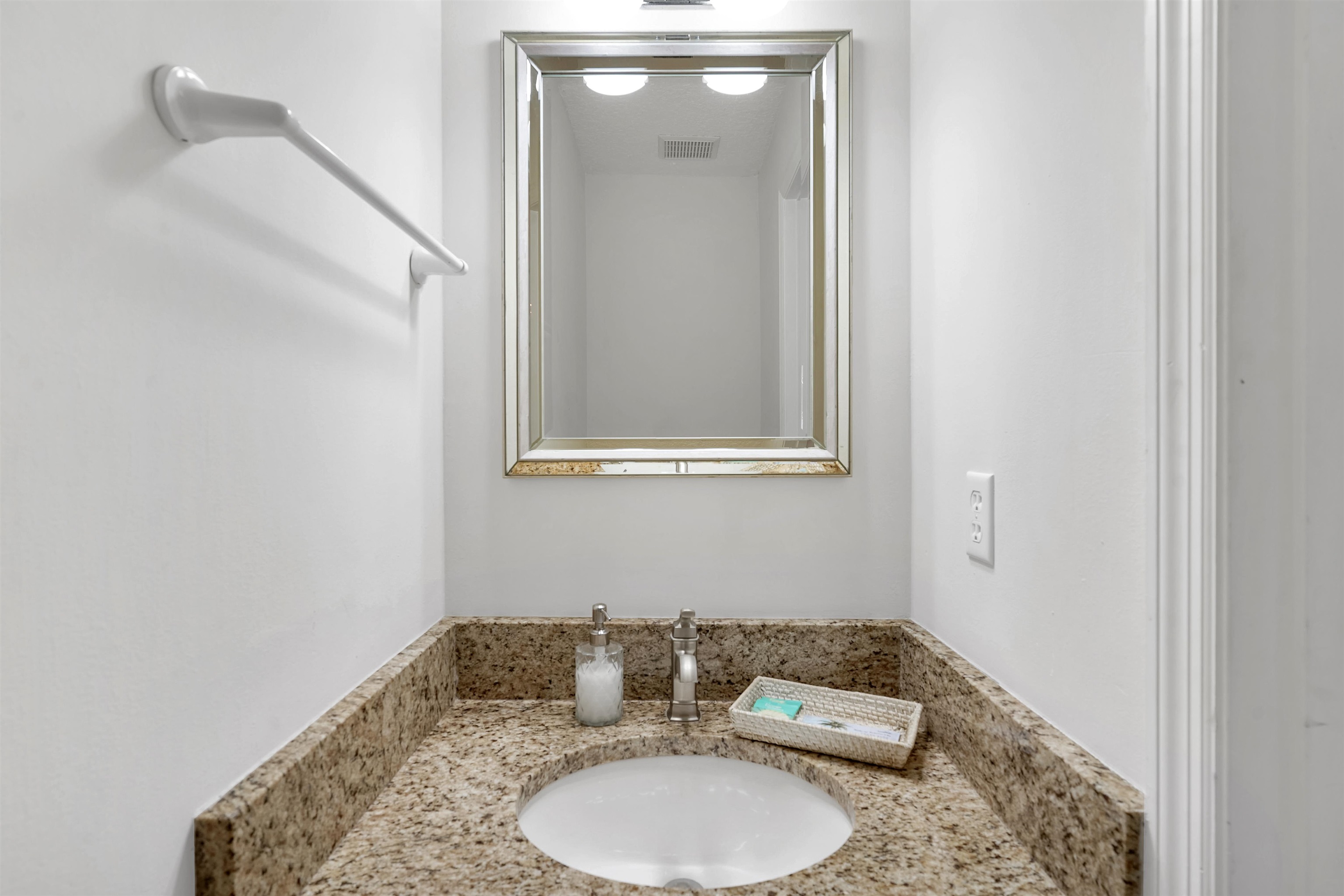 404 Fourteenth Street St. Augustine, FL 32084 - Photo 14 of 35 a bathroom with a granite countertop sink and a mirror