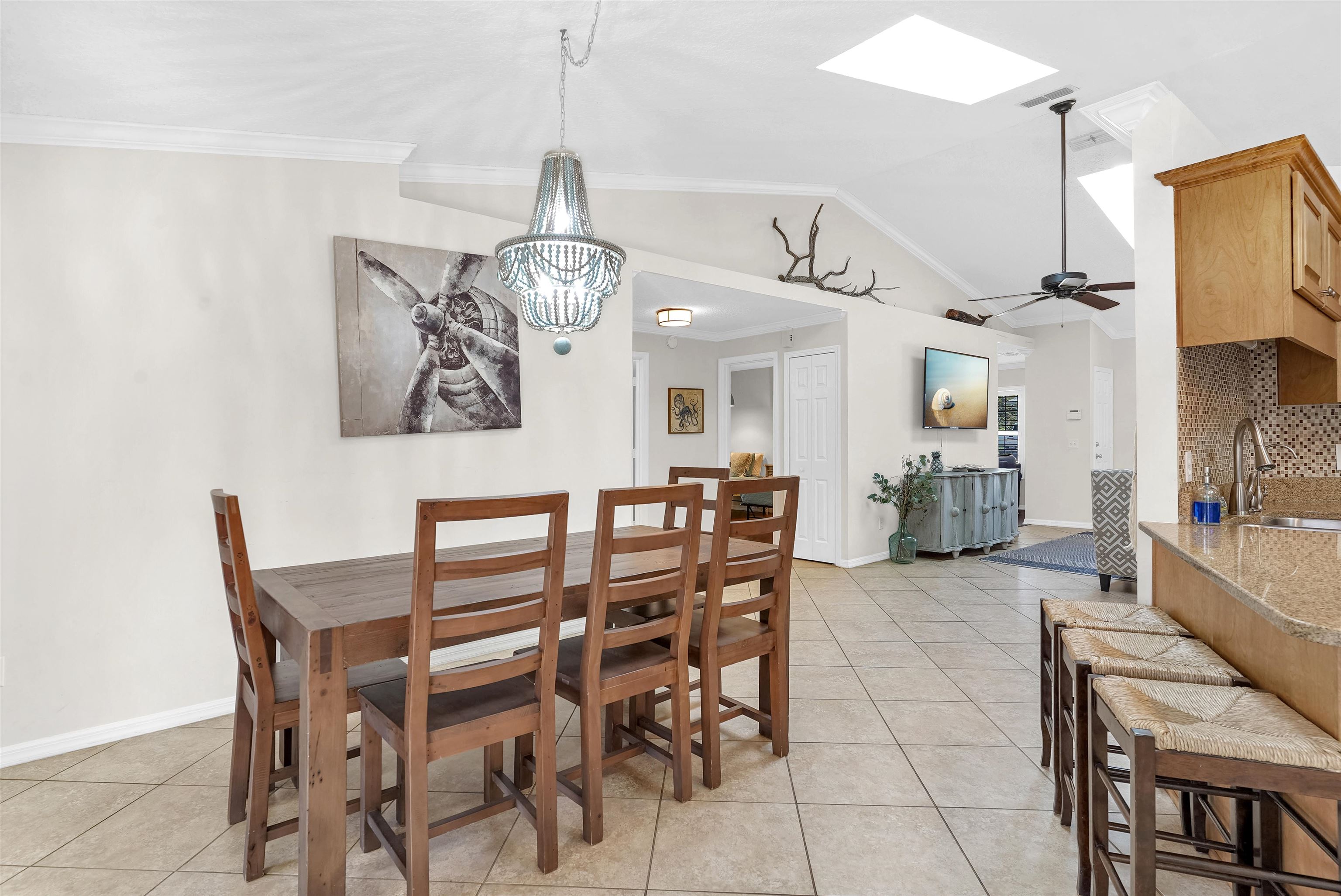 404 Fourteenth Street St. Augustine, FL 32084 - Photo 15 of 35 a view of a dining room and livingroom with furniture wooden floor a chandelier