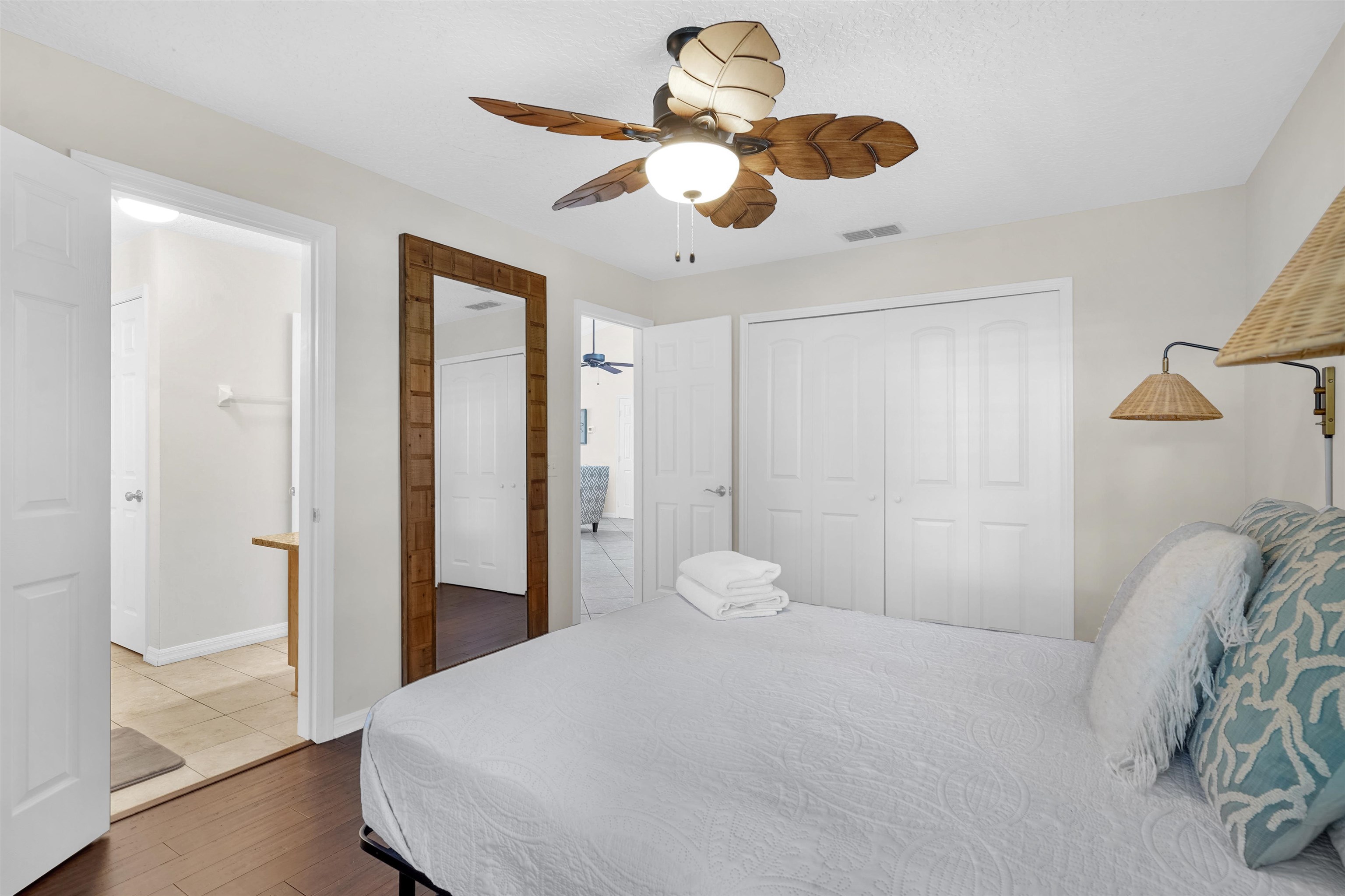 404 Fourteenth Street St. Augustine, FL 32084 - Photo 17 of 35 a bedroom with a bed and a chandelier