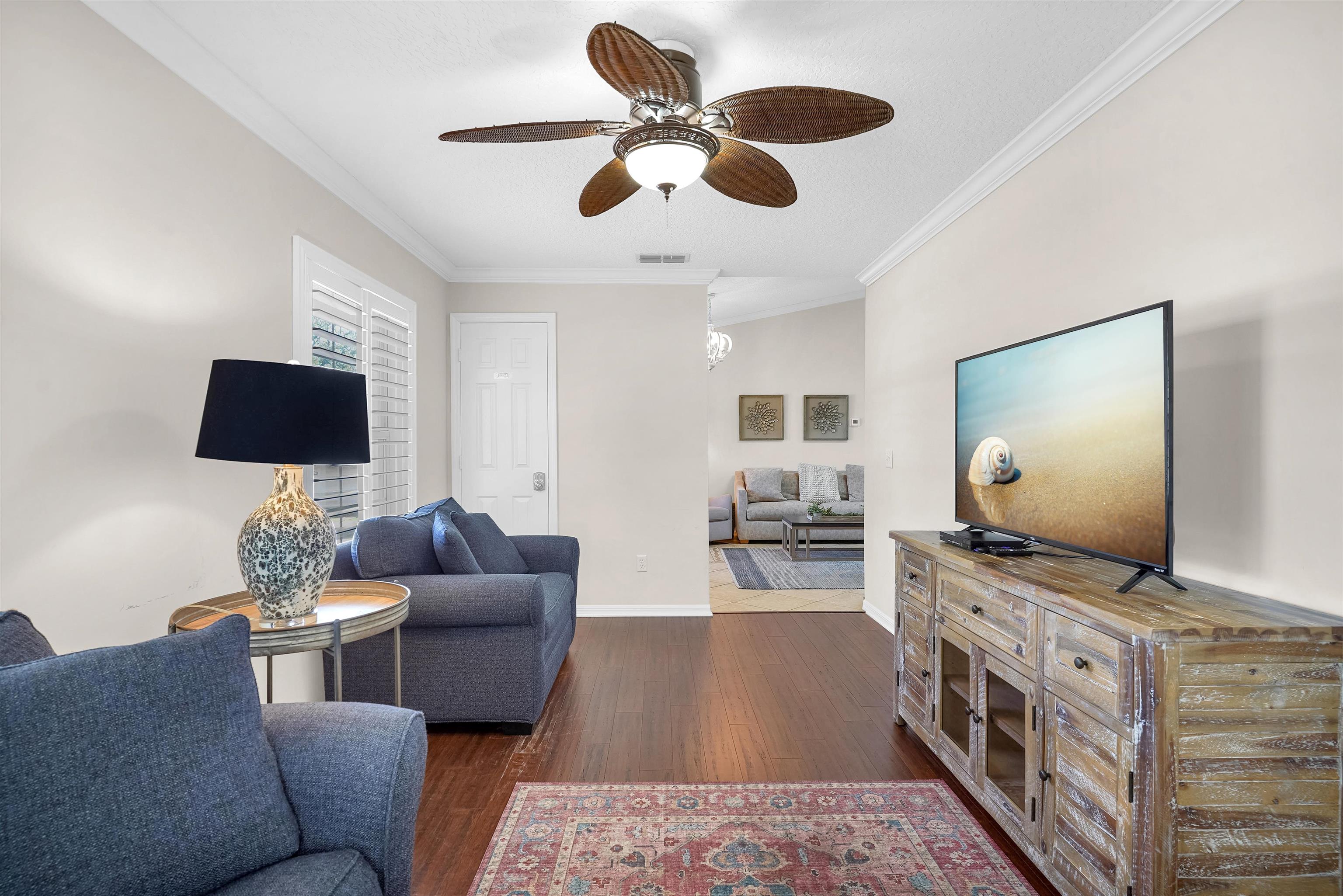 404 Fourteenth Street St. Augustine, FL 32084 - Photo 21 of 35 a living room with furniture and a flat screen tv