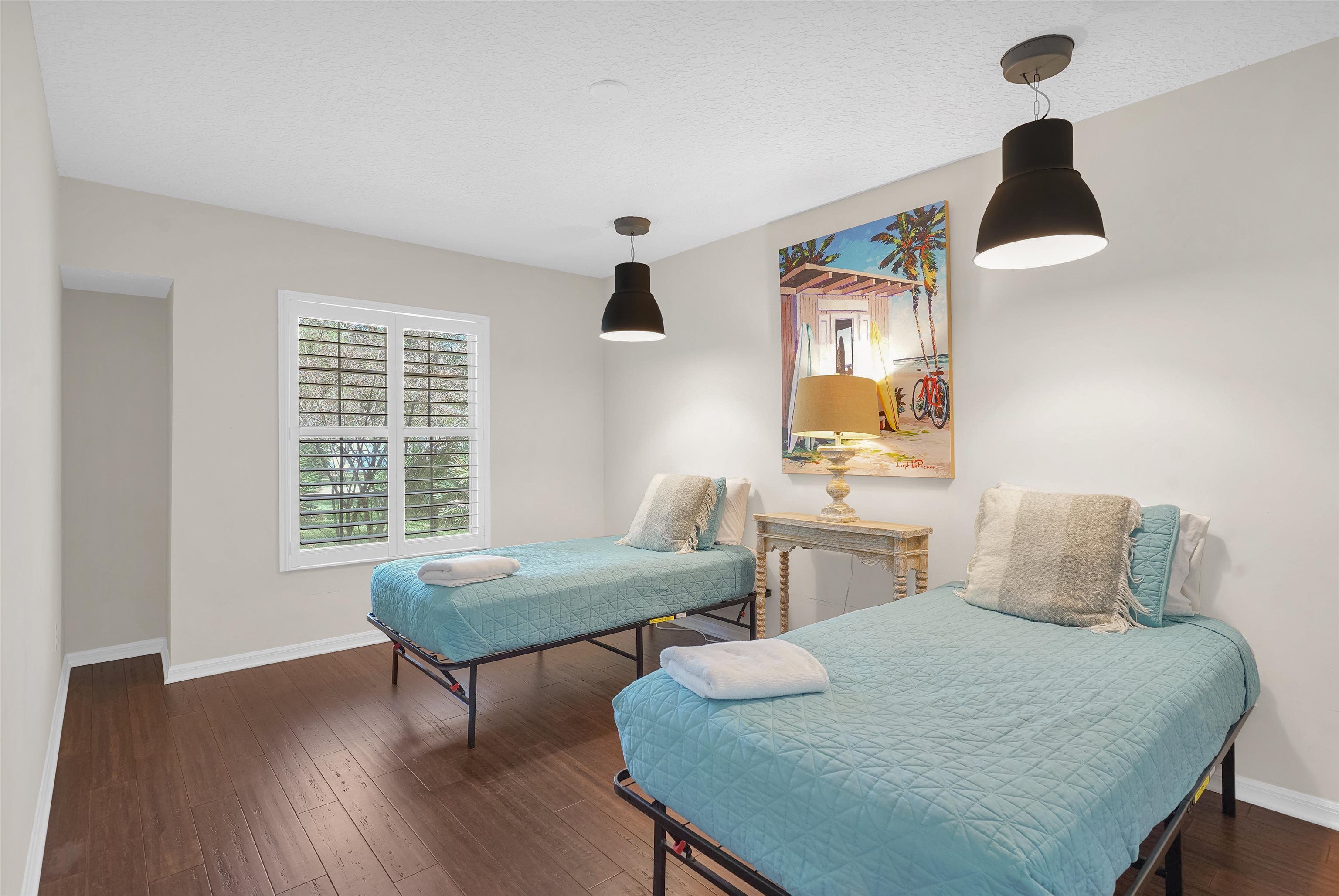 404 Fourteenth Street St. Augustine, FL 32084 - Photo 24 of 35 a bedroom with a bed and a table