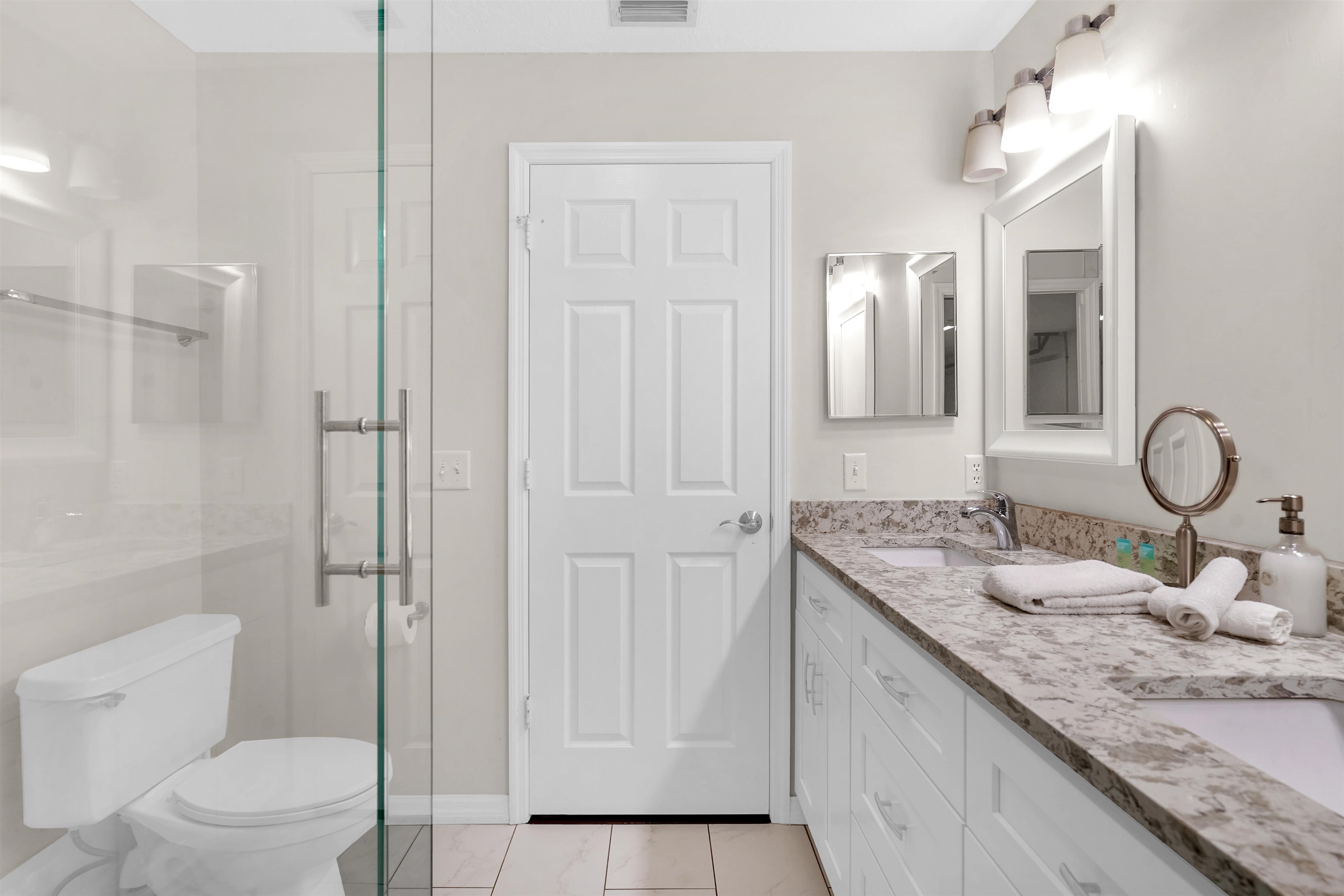 404 Fourteenth Street St. Augustine, FL 32084 - Photo 29 of 35 a bathroom with a granite countertop sink a toilet and a shower